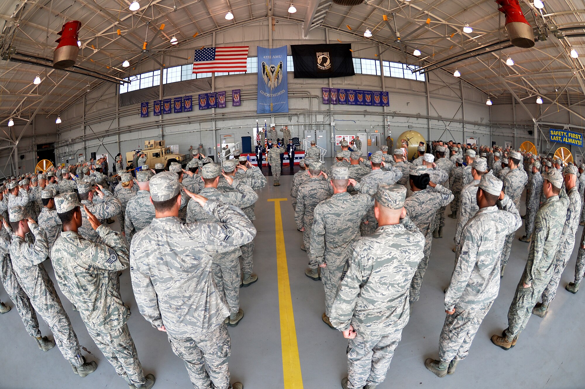 Airmen from the 1st Special Operations Mission Support Group salute during the 1st SOMSG change of command ceremony at the Commando Hangar on Hurlburt Field, Fla., July 28, 2014. The 1st SOMSG is made up of six squadrons and approximately 1,800 personnel. (U.S. Air Force photo/Senior Airman Christopher Callaway)