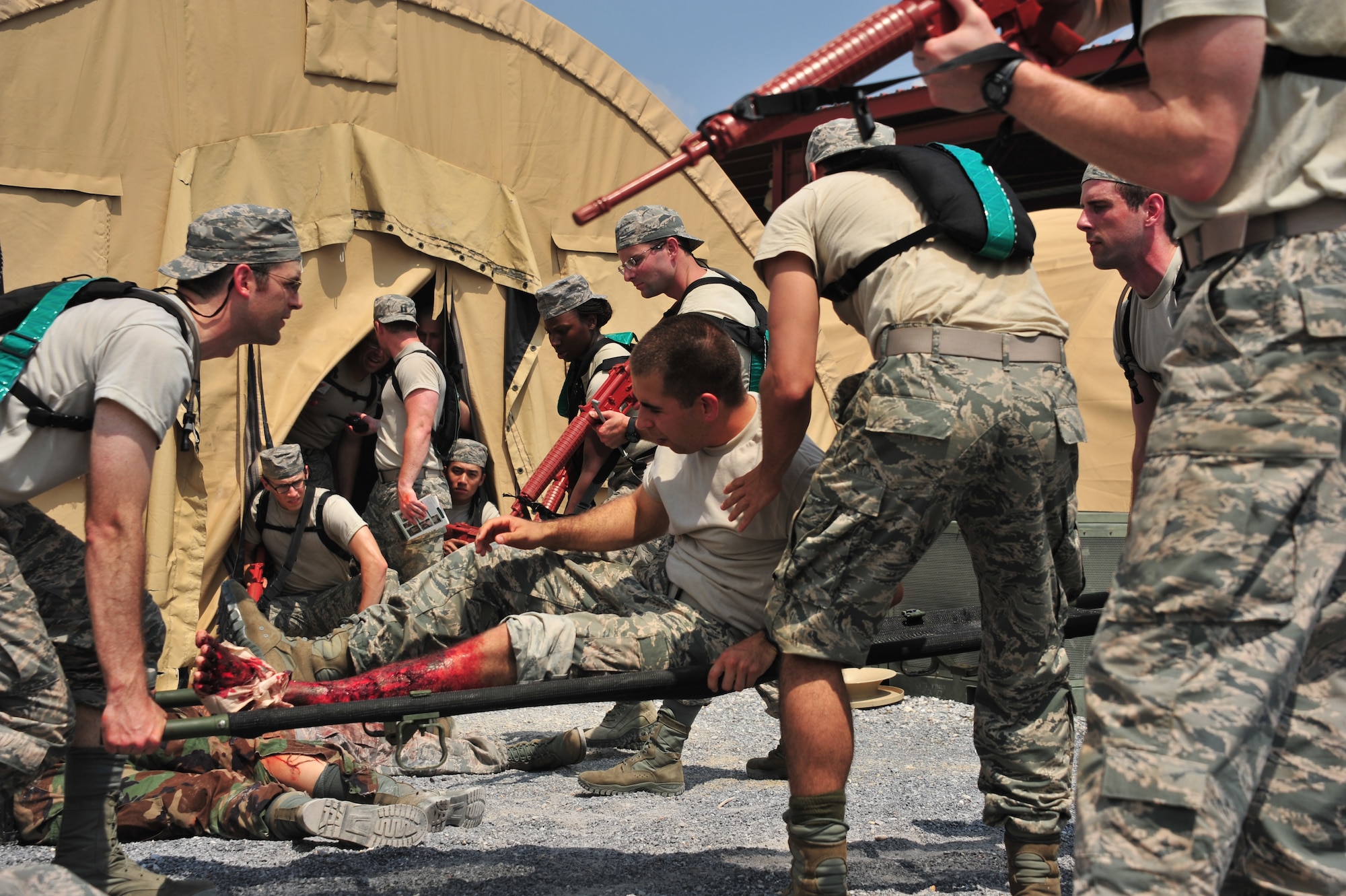 MAXWELL AIR FORCE BASE, Ala. -- Commissioned Officer Training School students take action in a simulated deployment scenario exercise at an Officer Training School complex here July 24, 2014. The exercise tested their leadership decision making skills as well as their contingency operations knowledge.  (U.S. Air Force photo by Staff Sgt. Natasha Stannard)