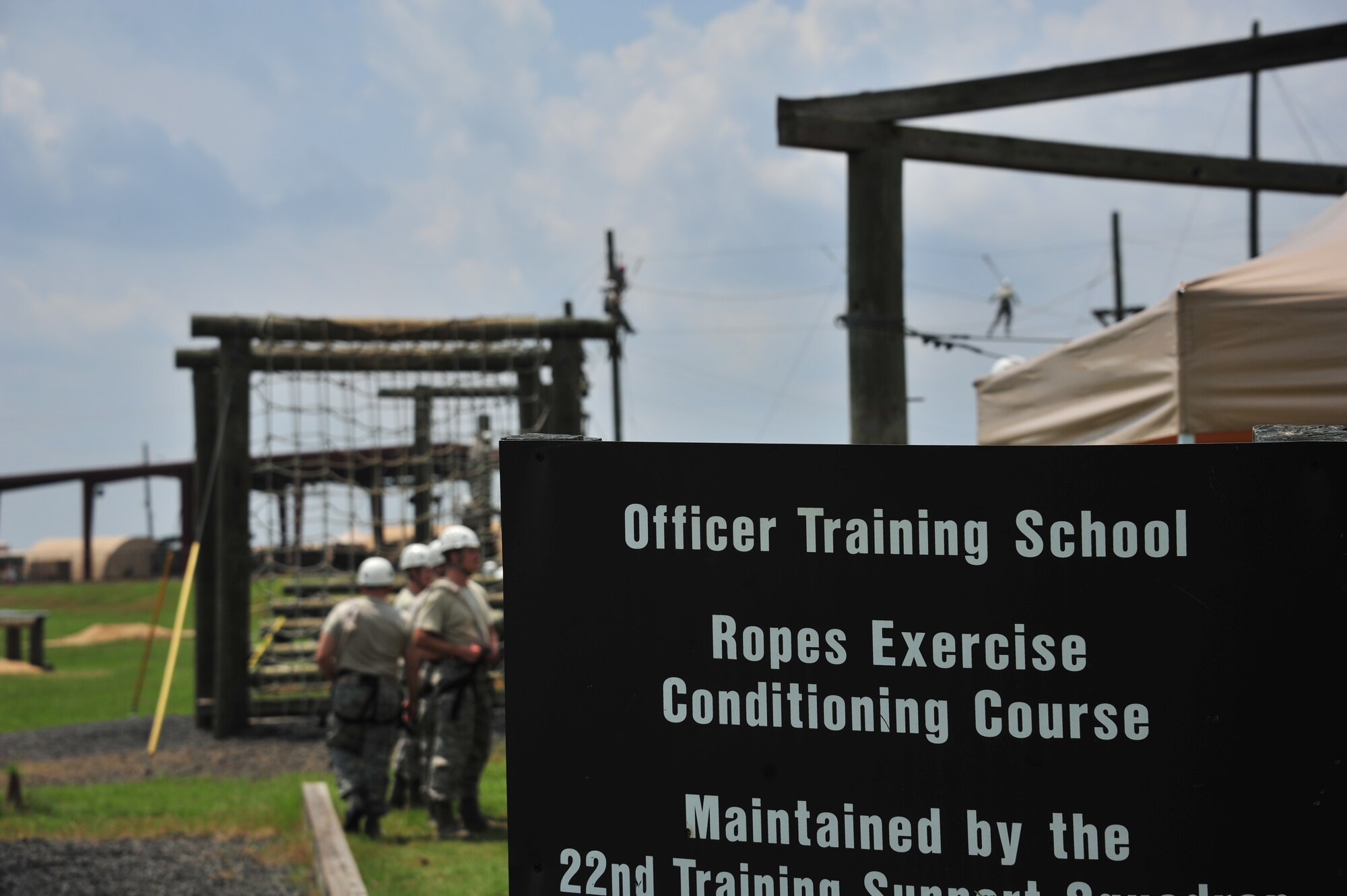 MAXWELL AIR FORCE BASE, Ala. -- Commissioned Officer Training students go through the Officer Training School ropes exercise conditioning course, July 24, 2014. The school supports-and is a part of the Jeanne M. Home Center for Officer Accessions and Citizen Development’s vision to forge motivated officers of character who embody warrior ethos. Air Force medical, legal and chaplain officers must go through this course after they commission into the Air Force. (U.S. Air Force photo by Staff Sgt. Natasha Stannard)