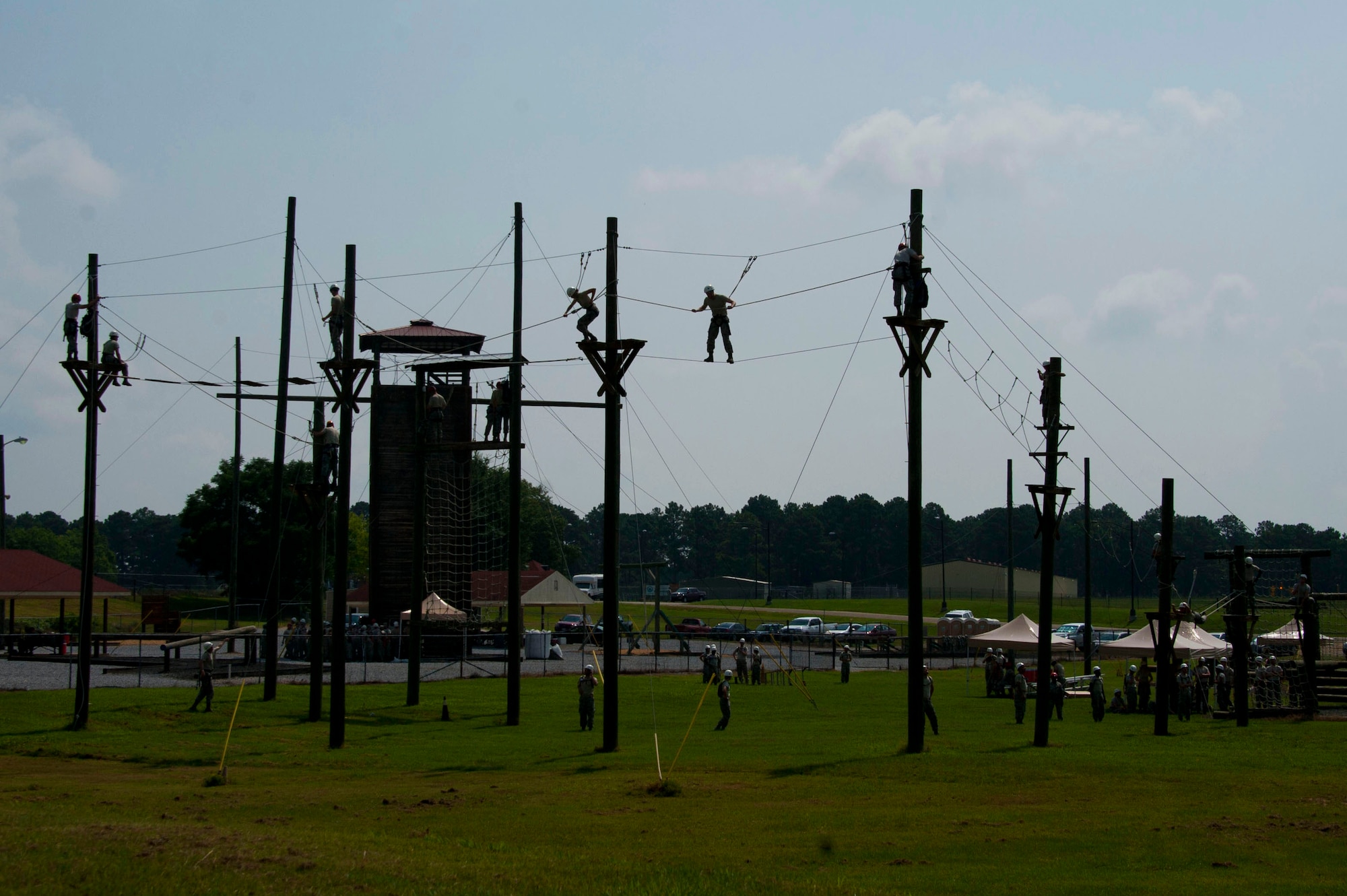 MAXWELL AIR FORCE BASE, Ala. -- Commissioned Officer Training students go through the Officer Training School ropes exercise conditioning course, July 24, 2014. The school supports-and is a part of the Jeanne M. Home Center for Officer Accessions and Citizen Development’s vision to forge motivated officers of character who embody warrior ethos. Air Force medical, legal and chaplain officers must go through this course after they commission into the Air Force. (U.S. Air Force photo by Staff Sgt. Natasha Stannard)