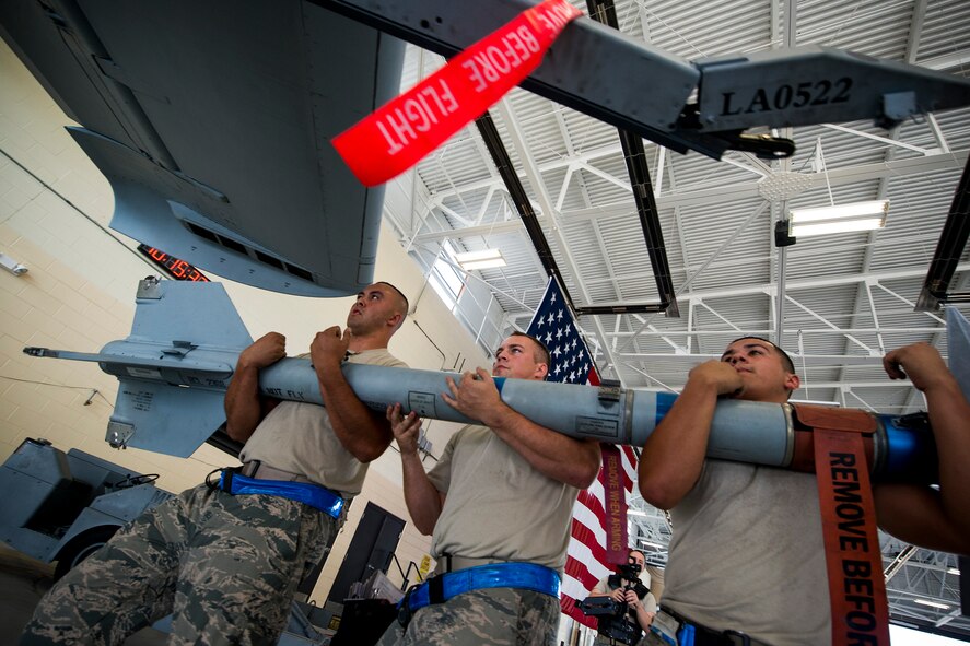 Members of a 74th Aircraft Maintenance Unit load crew transport an AIM-9 Sidewinder missile during a weapons load competition July 25, 2014, at Moody Air Force Base, Ga. The AIM-9 is a heat-seeking, air-to-air missile and was named after the sidewinder snake, which detects its prey via body heat. (U.S. Air Force photo by Staff Sgt. Jamal D. Sutter/Released)