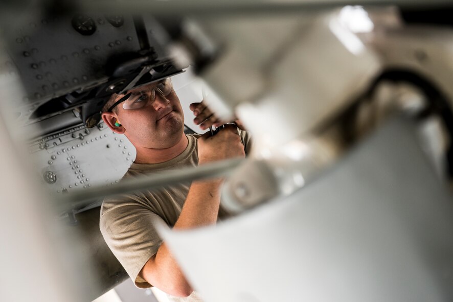 U.S. Air Force Staff Sgt. Benjamin Kaiser, 75th Aircraft Maintenance Unit load crew member, ensures an A-10C Thunderbolt II aircraft is safe to fly during a weapons load competition at Moody Air Force Base, Ga., July 25, 2014. The crews must load three weapons within 20 minutes whilst following all technical orders and safety procedures, and are awarded bonus points for each minute under the time limit. (U.S. Air Force photo by Airman 1st Class Ryan Callaghan/Released)