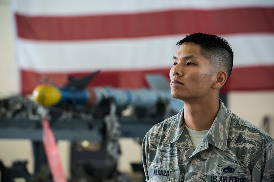 U.S. Air Force Tech. Sgt. Samuel Alonzo, 75th Aircraft Maintenance Unit load crew member, waits for a weapons load competition to officially start at Moody Air Force Base, Ga., July 25, 2014. Prior to the weapons-load portion of the competition, team members are evaluated on their military dress and appearance as well as job knowledge. (U.S. Air Force photo by Airman 1st Class Ryan Callaghan/Released)
