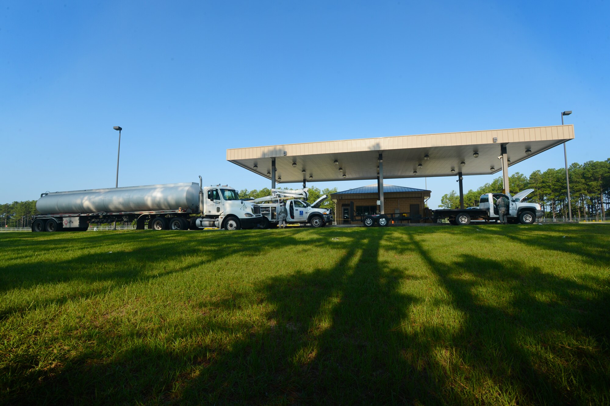 Normal operations at the commercial vehicle inspection area mean 100 percent vehicle checks at Shaw Air Force Base, S.C., July 24, 2014. During their twelve-hour shifts six days a week, the 20th Security Forces Squadron installation entry control Airmen inspect roughly 15,000 commercial vehicles each year. (U.S. Air Force photo by Airman 1st Class Jensen Stidham/Released)