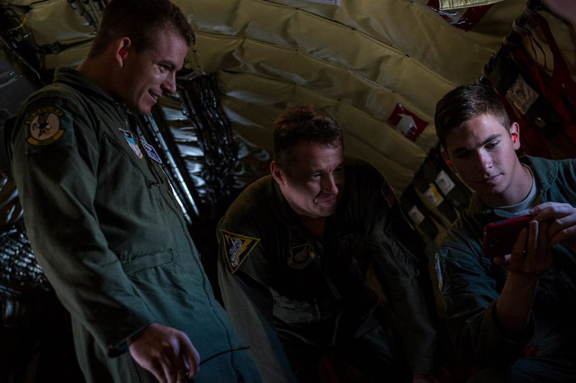 U.S. Air Force Lt. Col. Reese Evers, KC-135 Stratotanker pilot from the 96th Air Refueling Wing, talks to Air Force Academy Cadets about the photos they took during an air refueling for the Rim of the Pacific exercise July 18, 2014, over Hawaii. Twenty-two nations, more than 40 ships, six submarines, and more than 200 aircraft and 25,000 personnel will participate in the biennial Rim of the Pacific (RIMPAC) exercise 2014 scheduled June 26 to Aug. 1, in and around the Hawaiian Islands and Southern California. The world's largest international maritime exercise, RIMPAC provides a unique training opportunity that helps participants foster and sustain cooperative relationships that are critical to ensuring the safety of sea lanes and security on the world's oceans. RIMPAC 2014 is the 24th exercise in the series that began in 1971. (U.S. Air Force photo by Senior Airman James Richardson)