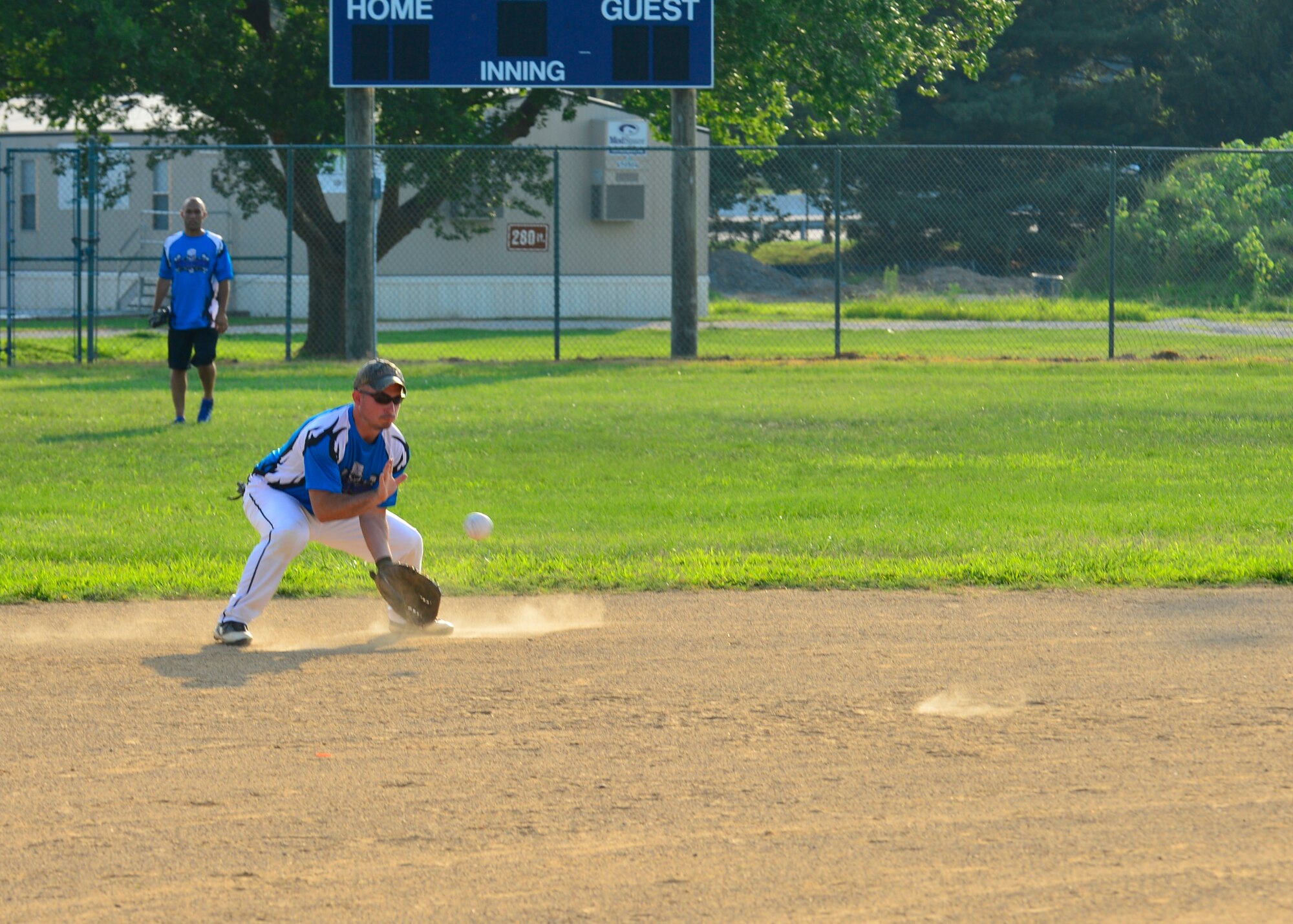 Nathaniel Correll, 436th Maintenance Squadron shortstop, fields a ground ball during an intramural softball game July 23, 2014, at the softball field on Dover Air Force Base, Del. The 436th MXS beat the 436th Civil Engineer team 13-11 in the American League matchup. (U.S. Air Force photo/Airman 1st Class William Johnson)