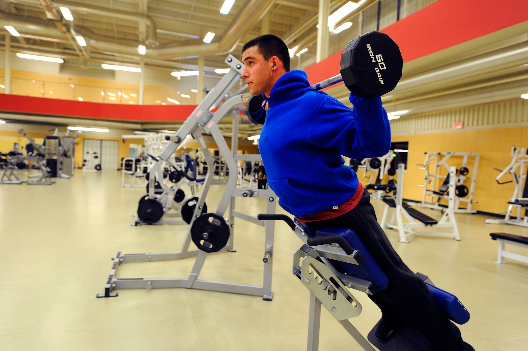 Airman 1st Class Dallas Crandell, 741st Missile Security Forces Squadron member, performs weighted back extensions at Malmstrom’s fitness center July 24 as part of his workout routine, which he does after hours due to his job. With Malmstrom Fitness Center’s new 24-hour policy, Airmen who work odd hours can now keep fit by utilizing the center’s equipment at any time. (U.S. Air Force photo/Airman 1st Class Collin Schmidt)
