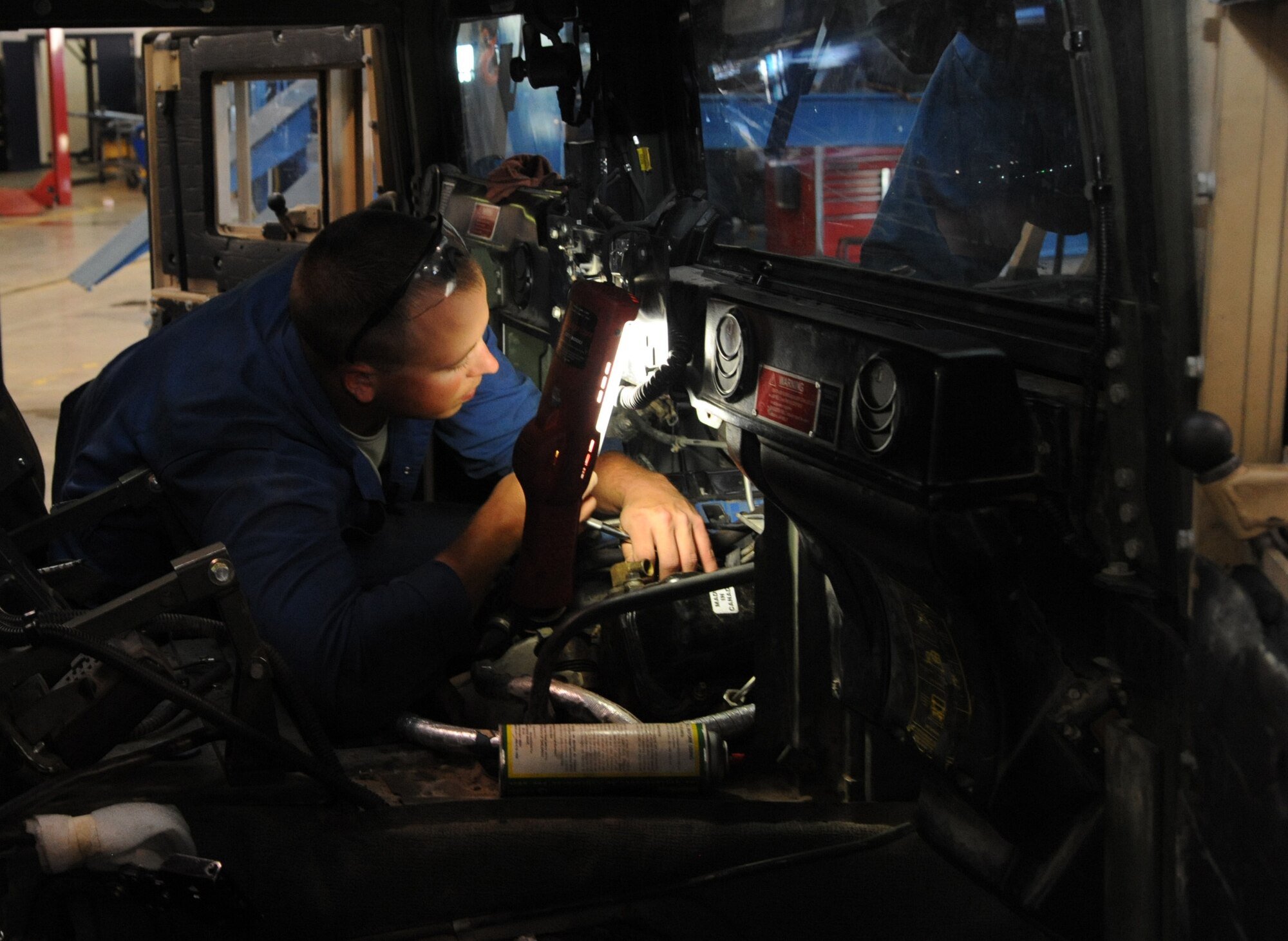Senior Airman Hunter Dombek, 341st Logistics Readiness Squadron vehicle mechanic, replaces a passenger side valve cover gasket/intake gaskets and turbo charger seals on a 6.5-liter diesel engine July 23. When junior airmen first arrive to the vehicle maintenance shop, they are tasked with performing the novice jobs such as oil changes, filter changes, and pressure washing the vehicles. (U.S. Air Force photo/Airman 1st Class Joshua Smoot)