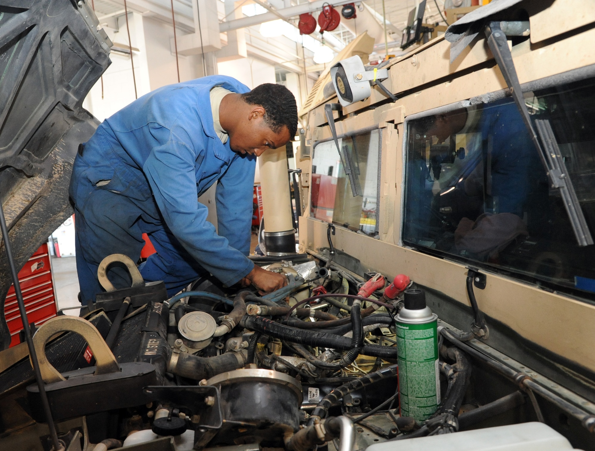 Airman 1st Class Latrelle Jones, 341st Logistics Readiness Squadron vehicle maintenance journeyman, replaces a passenger side valve cover gasket/intake gaskets and turbo charger seals on a 6.5-liter diesel engine July 23. Although the vehicle maintenance shop does work on multiple squadrons’ vehicles, their main mission is to support security forces. (U.S. Air Force photo/Airman 1st Class Joshua Smoot)