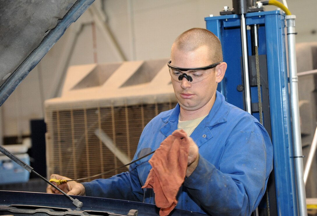 Senior Airman Benjamin Fisher, 341st Logistics Readiness Squadron vehicle mechanic, checks proper engine oil level after a scheduled lube, oil and filter change July 23. On average, the vehicle maintenance shop works on about 12 to 28 vehicles per week.  (U.S. Air Force photo/Airman 1st Class Joshua Smoot)