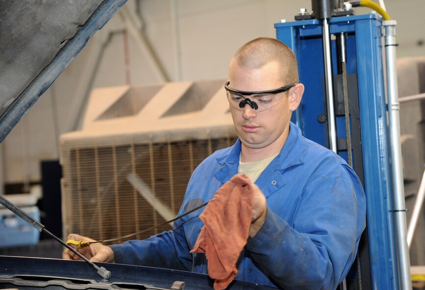 Senior Airman Benjamin Fisher, 341st Logistics Readiness Squadron vehicle mechanic, checks proper engine oil level after a scheduled lube, oil and filter change July 23. On average, the vehicle maintenance shop works on about 12 to 28 vehicles per week.  (U.S. Air Force photo/Airman 1st Class Joshua Smoot)