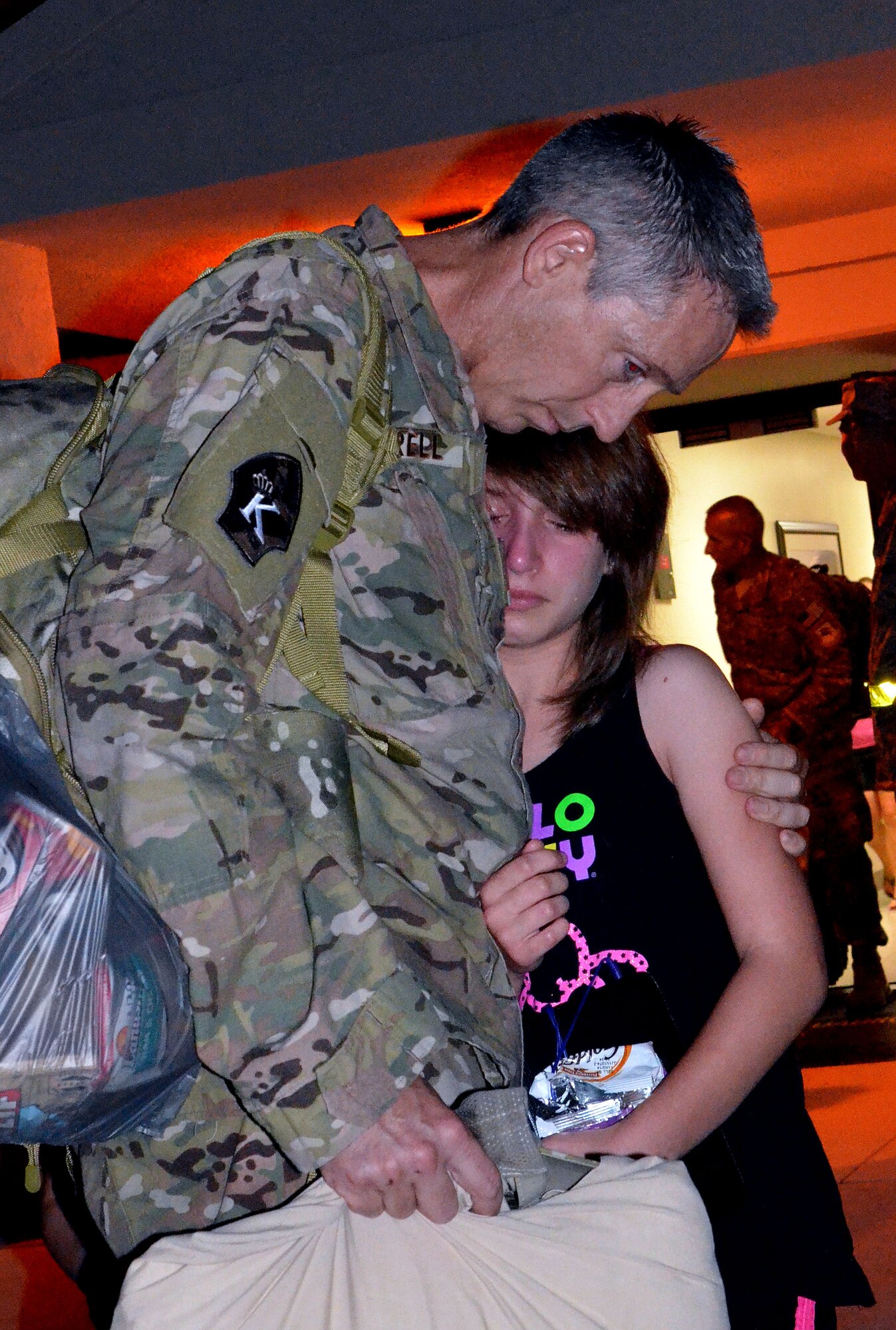 Members of the 920th Rescue Wing Maintenance Squadron prepare to deploy on July 23, 2014 at Patrick Air Force Base, Fla.  Airmen say goodbye to friends and family before departing on a C-5 Galaxy to aid the search and rescue mission in the horn of Africa region. The 920th RQW performs combat search and rescue as its primary mission, which includes rescuing downed pilots.  Additionally the 920th RQW is responsible for civil search and rescue, humanitarian relief and support of rocket launches. To date, the unit has saved more than 3,000 lives, both in peacetime and combat. (U.S. Air Force photo /Staff Sgt. Sarah Pullen)