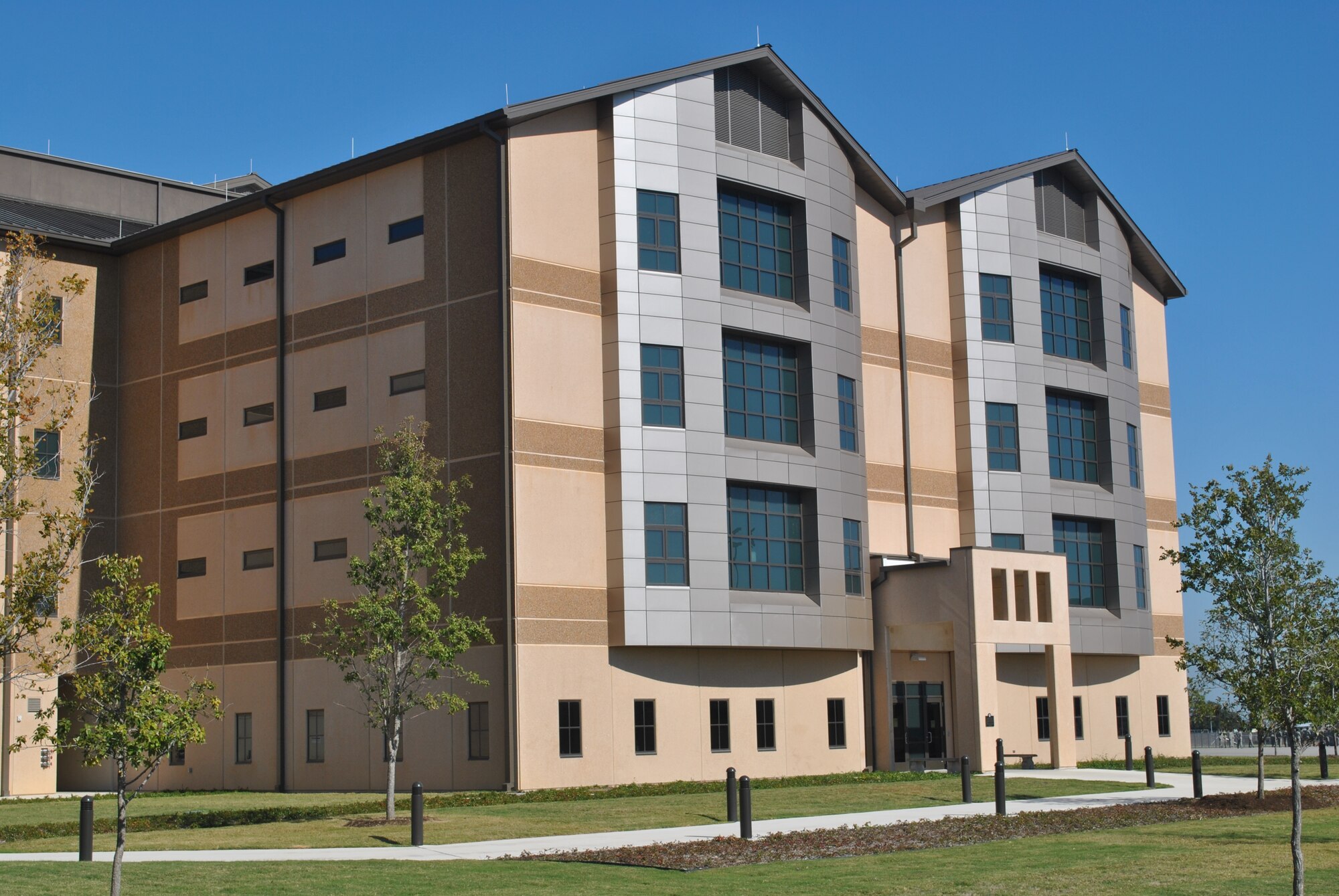 The Air Force Civil Engineer Center is managing and overseeing a project to replace existing basic training facilities with new, state-of-the-art, Airman Training Complexes at Joint Base San Antonio-Lackland, Texas. A small business served as prime contractor for the project, developing the master plan, facility condition assessments, architectural programming and planning, geographic information system mapping and geodatabase design for the $900 million complex. (U.S. Air Force photo/Alan Boedeker)