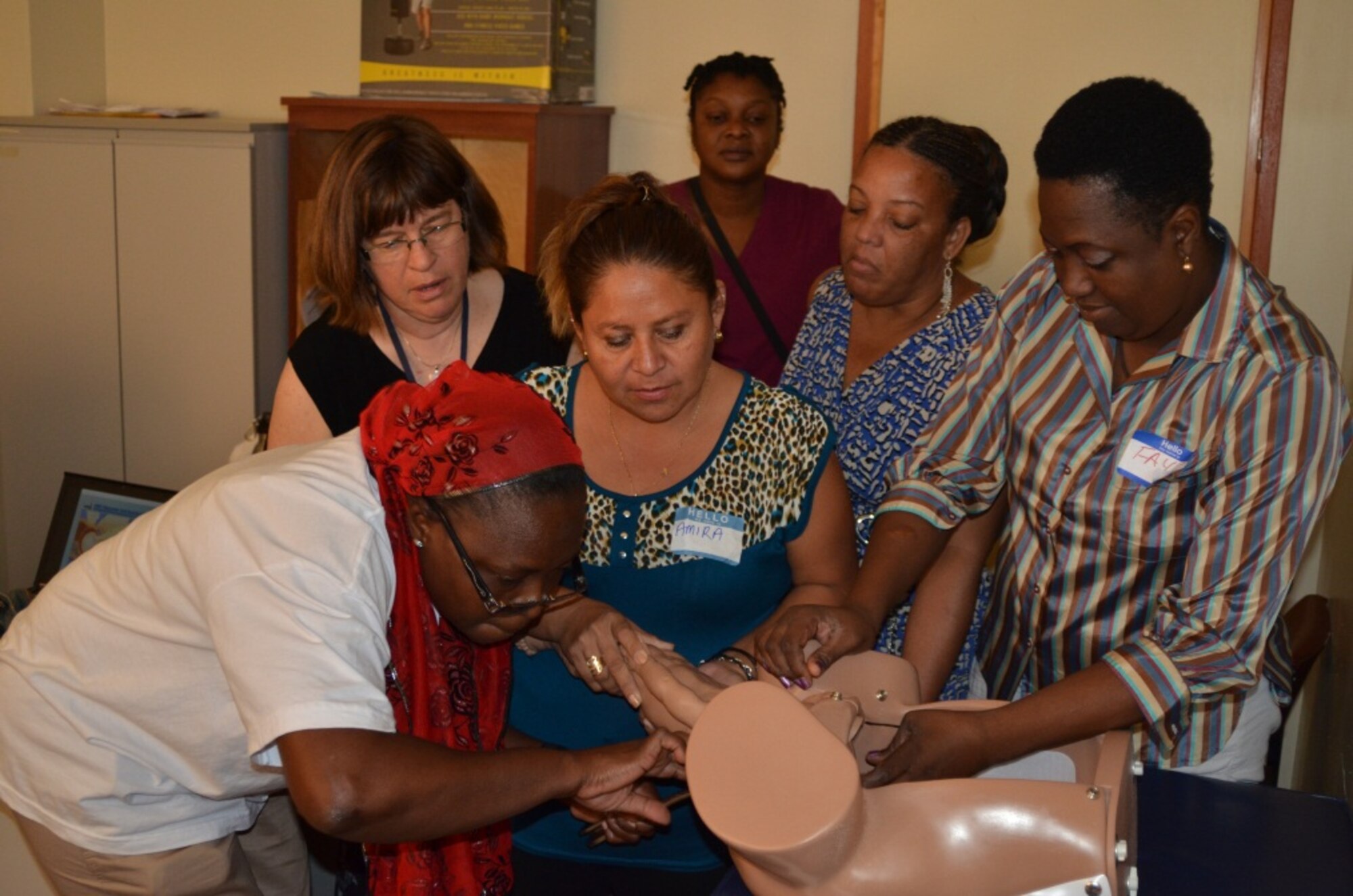 Dr. Lesley Atwood and Belizean students perform an assisted vaginal delivery during the Global Advanced Life Support in Obstetrics Instructor and Provider Courses in Belize City, Belize from July 22-24. (Courtesy Photo)