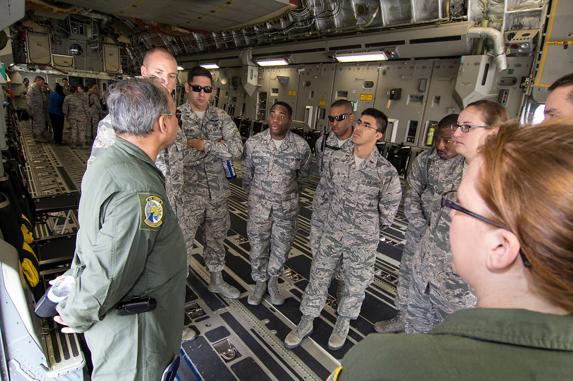 Tech Sgt. Al Pempsell and Senior Airman Candice Elvis, 300th Airlift Squadron loadmasters, explain the airlift capabilities of the C-17 Globemaster III as visiting Chaplain Candidates tour the jet and get demonstrations and briefings from the Reserve crew. The Air Force Chaplain Candidate Program allows seminary and other professional religious school students to evaluate their compatibility and potential for commissioning as an Air Force Chaplain. The focus  of the chaplain candidate program is on experiencing ministry in the Air Force during a summer tour of active duty. Upon entering the program, individuals are commissioned as a chaplain candidate, in the grade of Second Lieutenant. After graduation and obtaining an ecclesiastical endorsement, candidates are then eligible for reappointment as a chaplain in either, the U.S. Air Force Reserve, the Air National Guard or placed on active duty. (U.S. Air Force photo / Michael Dukes)
