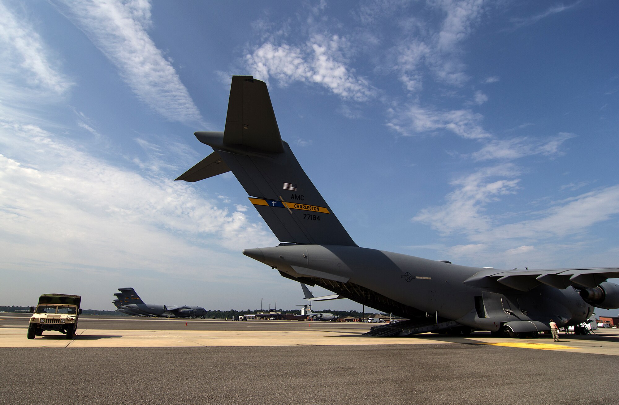 A 315th Aeromedical Evacuation Squadron Humvee sits on the Joint Base Charleston, South Carolina flight line behins a C-17 Globemaster III as visiting Chaplain Candidates tour the jet and get demonstrations and briefings from the Reserve crew. The Air Force Chaplain Candidate Program allows seminary and other professional religious school students to evaluate their compatibility and potential for commissioning as an Air Force Chaplain. The focus  of the chaplain candidate program is on experiencing ministry in the Air Force during a summer tour of active duty. Upon entering the program, individuals are commissioned as a chaplain candidate, in the grade of Second Lieutenant. After graduation and obtaining an ecclesiastical endorsement, candidates are then eligible for reappointment as a chaplain in either, the U.S. Air Force Reserve, the Air National Guard or placed on active duty. (U.S. Air Force photo / Michael Dukes)