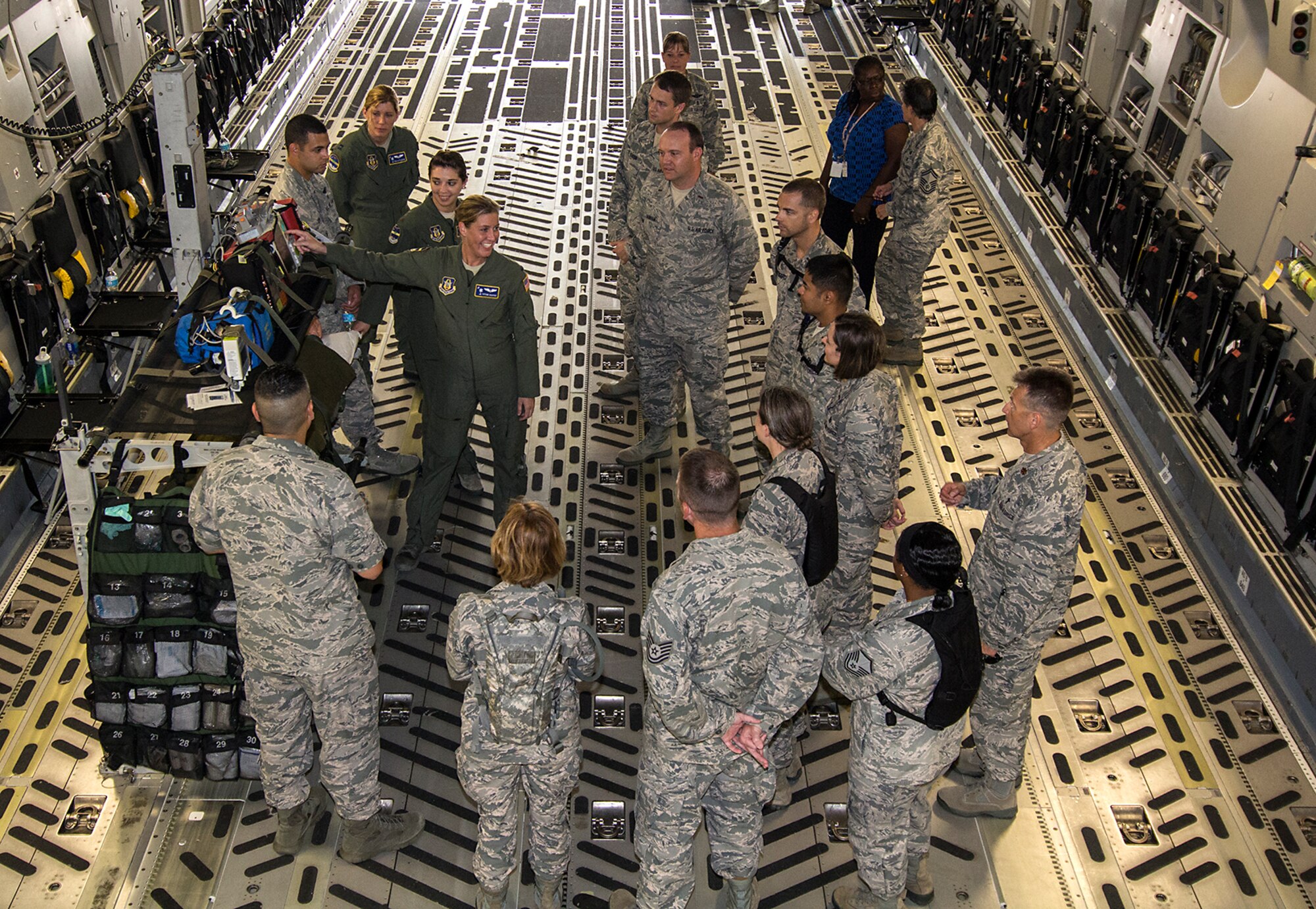 1st Lt. Tiffani Harper, 315th Aermoedical Evacuation Squadron flight nurse, explains how the C-17 Globemaster III can be converted to a flying ambulance to evacuate war wounded and sick to Air Force Chaplain Candidates who were visiting Joint Base Charleston, South Carolina. The Air Force Chaplain Candidate Program allows seminary and other professional religious school students to evaluate their compatibility and potential for commissioning as an Air Force Chaplain. The focus  of the chaplain candidate program is on experiencing ministry in the Air Force during a summer tour of active duty. Upon entering the program, individuals are commissioned as a chaplain candidate, in the grade of Second Lieutenant. After graduation and obtaining an ecclesiastical endorsement, candidates are then eligible for reappointment as a chaplain in either, the U.S. Air Force Reserve, the Air National Guard or placed on active duty. (U.S. Air Force photo / Michael Dukes)