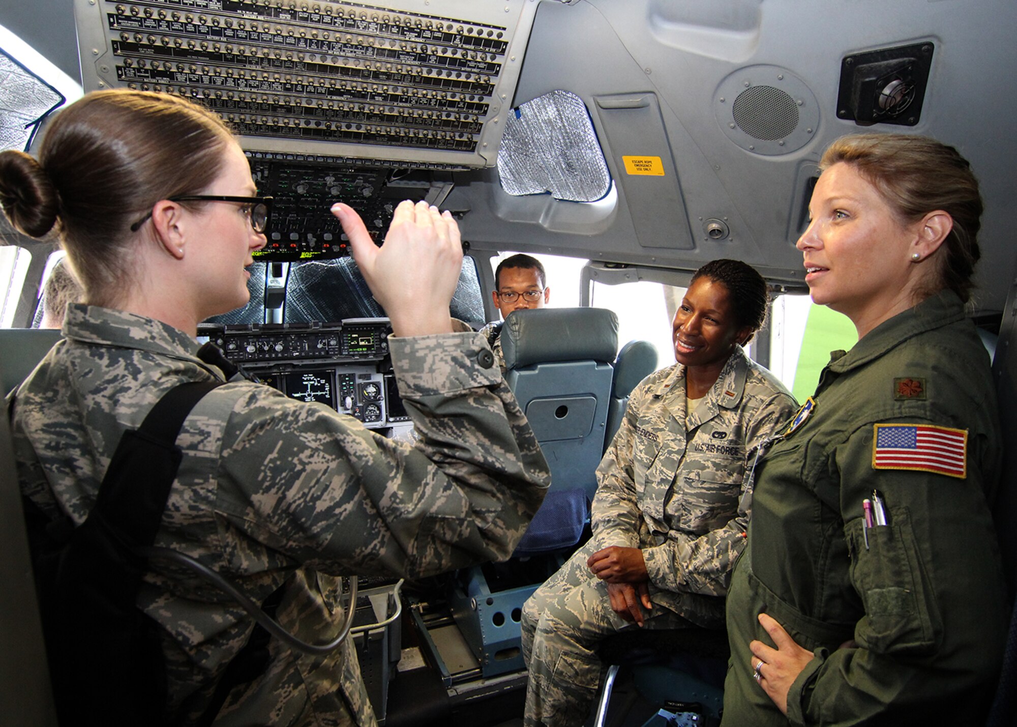 Maj. Jennifer Phillips, 300th Airlift Squadron pilot, explains the various aspects of a pilot's responsibilities on the C-17 Globemaster III and the capabilities of the jet to Air Force Chaplain Candidates who were visiting Joint Base Charleston, South Carolina. The Air Force Chaplain Candidate Program allows seminary and other professional religious school students to evaluate their compatibility and potential for commissioning as an Air Force Chaplain. The focus  of the chaplain candidate program is on experiencing ministry in the Air Force during a summer tour of active duty. Upon entering the program, individuals are commissioned as a chaplain candidate, in the grade of Second Lieutenant. After graduation and obtaining an ecclesiastical endorsement, candidates are then eligible for reappointment as a chaplain in either, the U.S. Air Force Reserve, the Air National Guard or placed on active duty. (U.S. Air Force photo / Michael Dukes)