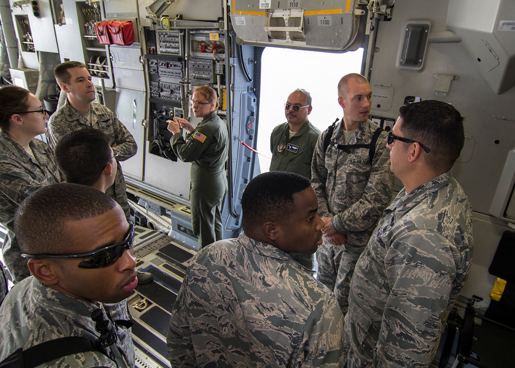 Senior Airman Candice Elvis and Tech. Sgt. Al Pempsell, both from the 300th Airlift Squadron, explain the various aspects of a loadmaster’s responsibilities on the C-17 Globemaster III to Air Force Chaplain Candidates who were visiting Joint Base Charleston, South Carolina. The Air Force Chaplain Candidate Program allows seminary and other professional religious school students to evaluate their compatibility and potential for commissioning as an Air Force Chaplain. The focus  of the chaplain candidate program is on experiencing ministry in the Air Force during a summer tour of active duty. Upon entering the program, individuals are commissioned as a chaplain candidate, in the grade of Second Lieutenant. After graduation and obtaining an ecclesiastical endorsement, candidates are then eligible for reappointment as a chaplain in either, the U.S. Air Force Reserve, the Air National Guard or placed on active duty. (U.S. Air Force photo / Michael Dukes)