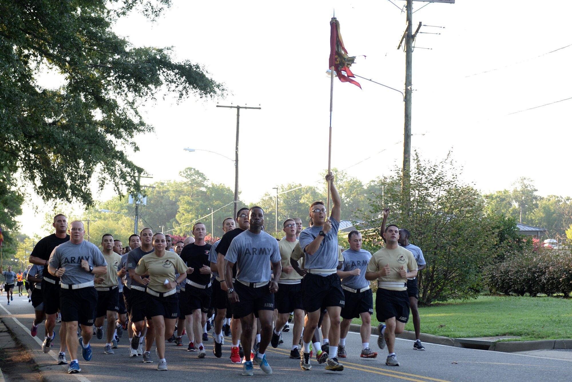 U.S. Army Soldiers from the 359th Inland Cargo Transfer Company, 10th Transportation Battalion, 7th Transportation Brigade (Expeditionary) run a memorial 5K at Fort Eustis, Va., July 25, 2014. More than 100 Soldiers ran in honor of three comrades who made the ultimate sacrifice while deployed to Afghanistan in 2013. (U.S. Air Force photo by Senior Airman Teresa J.C. Aber/Released)