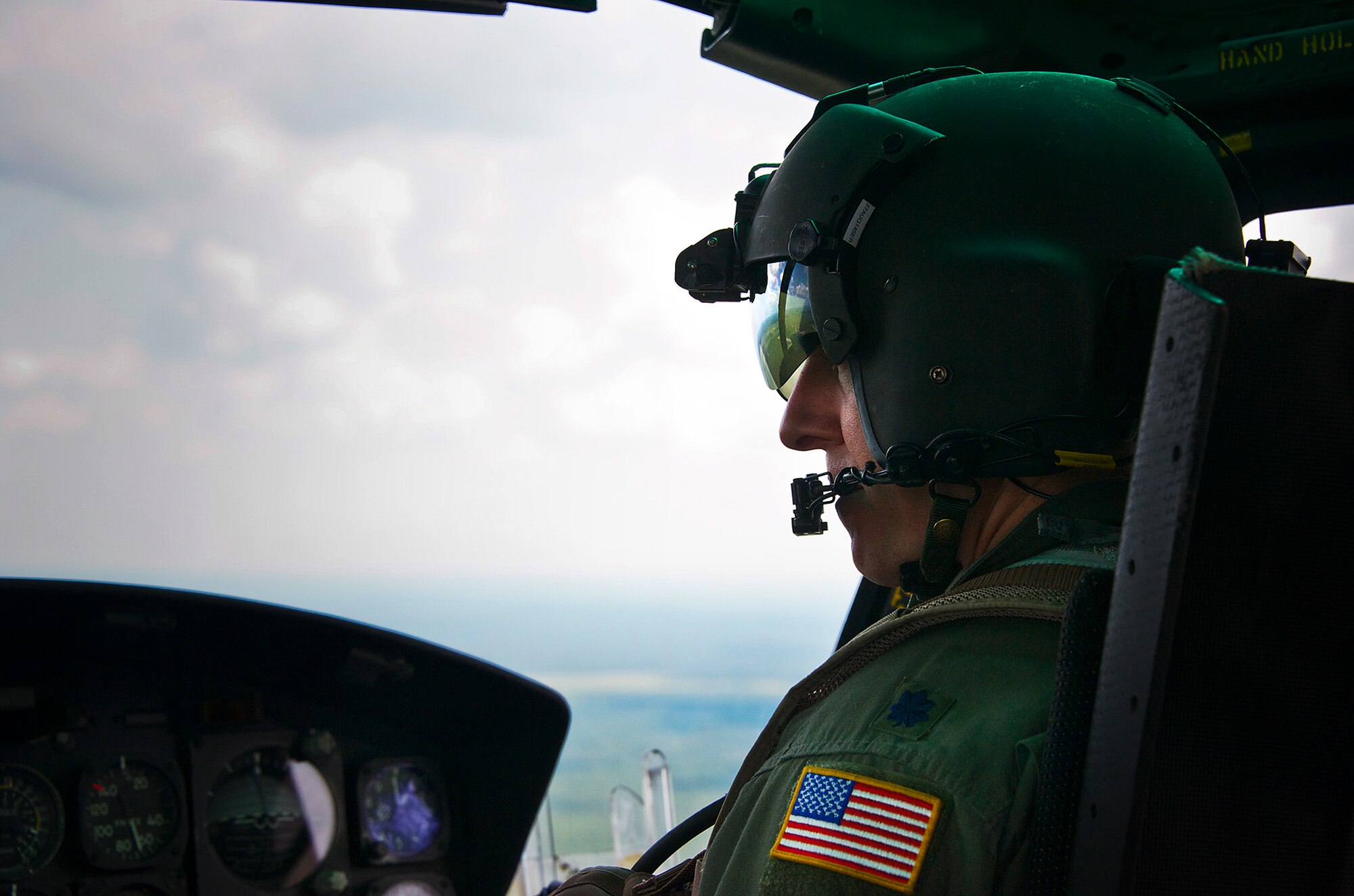 Lt. Col. Jonathan Cary copilots a UH-1 Huey during a routine flight over the Eglin range in June. The Hueys are part of the 413th Flight Test Squadron based out of Duke Field which provides the only developmental test and evaluation for helicopters in the Air Force. (U.S. Air Force photo/Sara Vidoni)