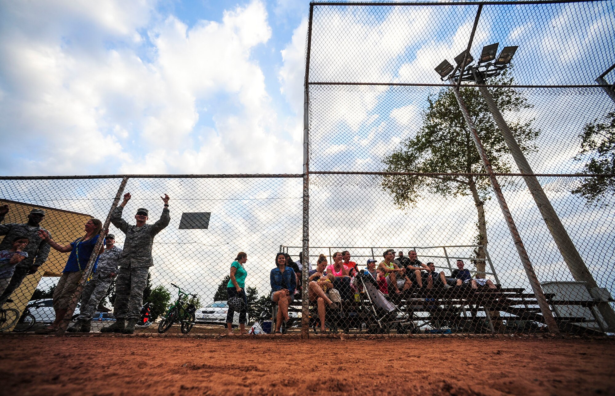A crowd watches a softball game between the 39th Communications Squadron and the 39th Wing Staff Agencies July 25, 2014, Incirlik Air Base, Turkey. The 39th WSA took the title as the 2014 softball champions.  (U.S. Air Force photo by Senior Airman Nicole Sikorski/Released) 