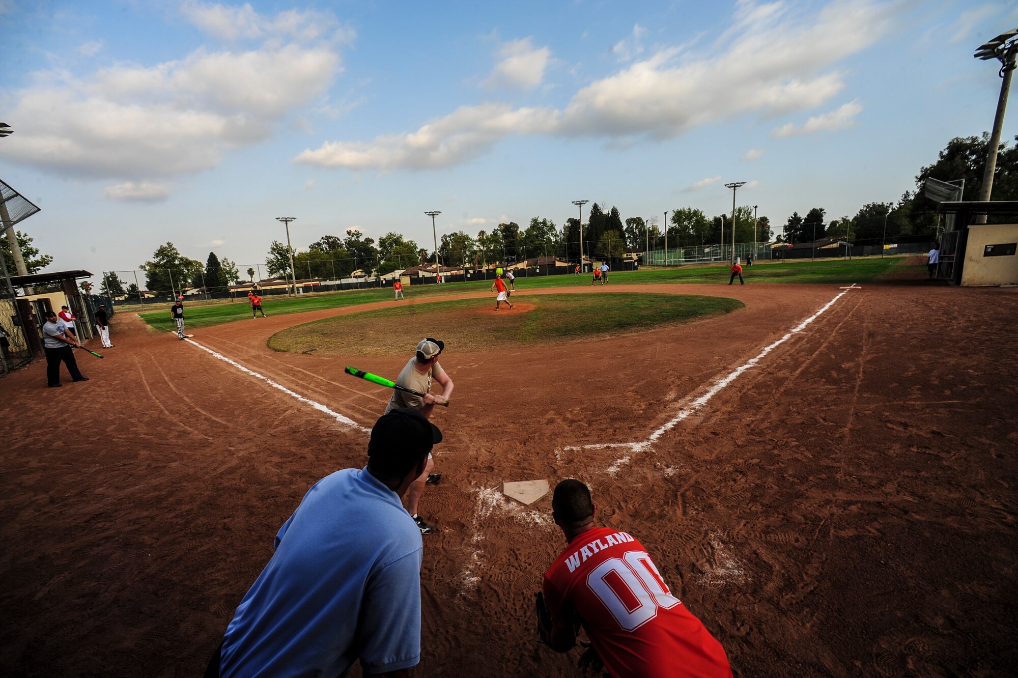Airmen from the 39th Communications Squadron and the 39th Wing Staff Agencies play softball July 25, 2014, Incirlik Air Base, Turkey. The 39th Force Support Squadron offers year-round intramural sports to all Team Incirlik members. (U.S. Air Force photo by Senior Airman Nicole Sikorski/Released)