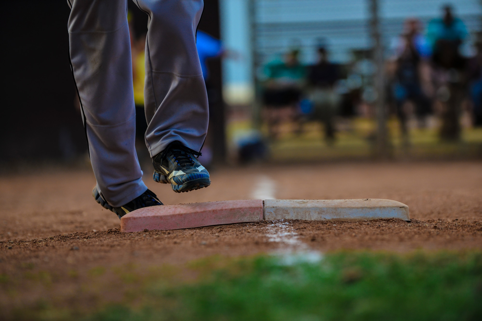 A softball player runs towards second base during a softball game between the 39th Communications Squadron and 39th  Wing Staff Agencies July 25, 2014, Incirlik Air Base, Turkey. Ten teams participated in the 2014 intramurals softball season which resulted in the 39th WSA winning the championship game with a victory of 12-3. (U.S. Air Force photo by Senior Airman Nicole Sikorski/Released) 