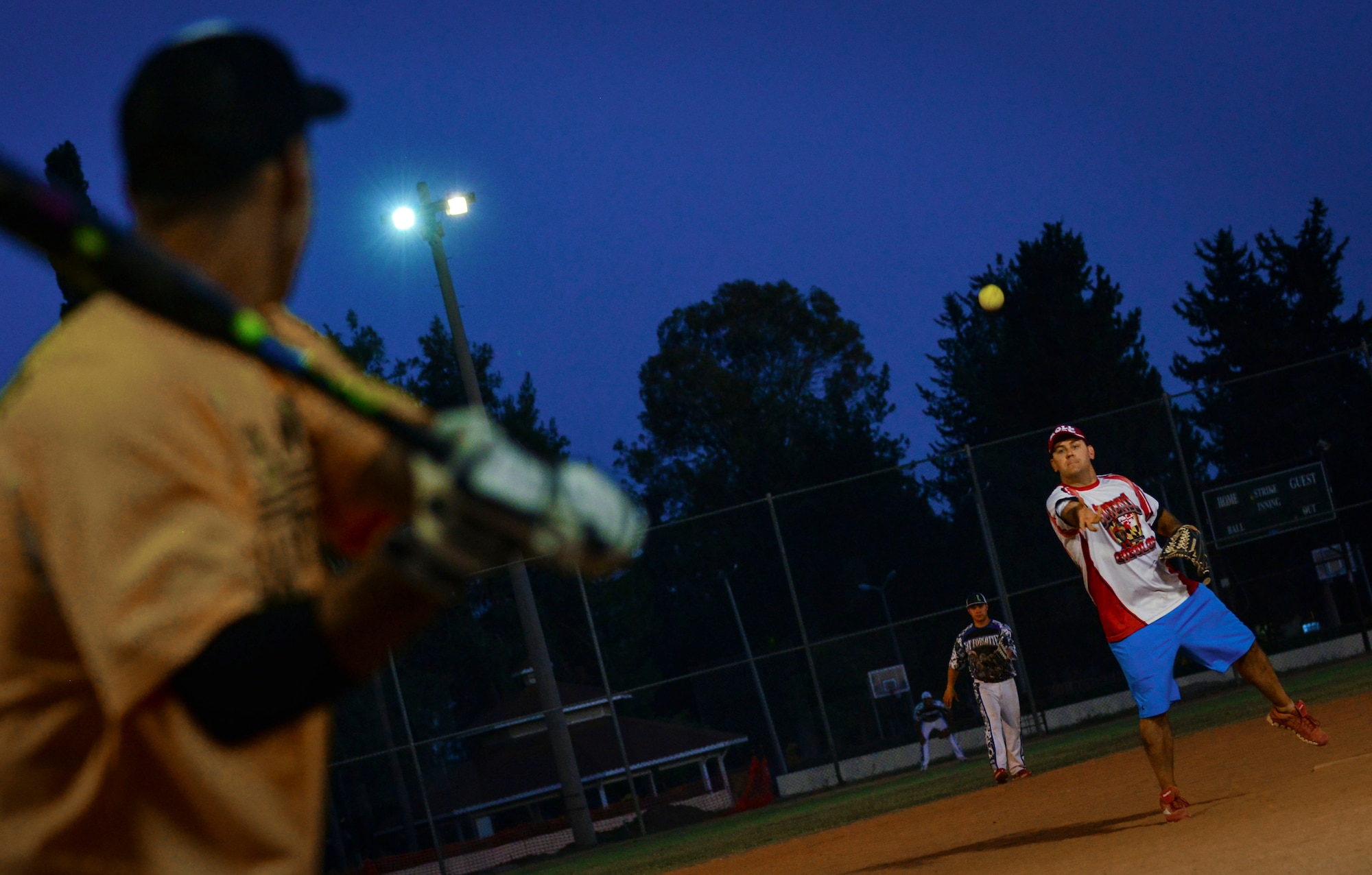 Royce Kerbow pitches a ball during a softball tournament June 25, 2014, Incirlik Air Base, Turkey. The 39th Wing Staff Agencies took the title of the 2014 base softball champions. (U.S. Air Force photo by Senior Airman Nicole Sikorski/Released) 