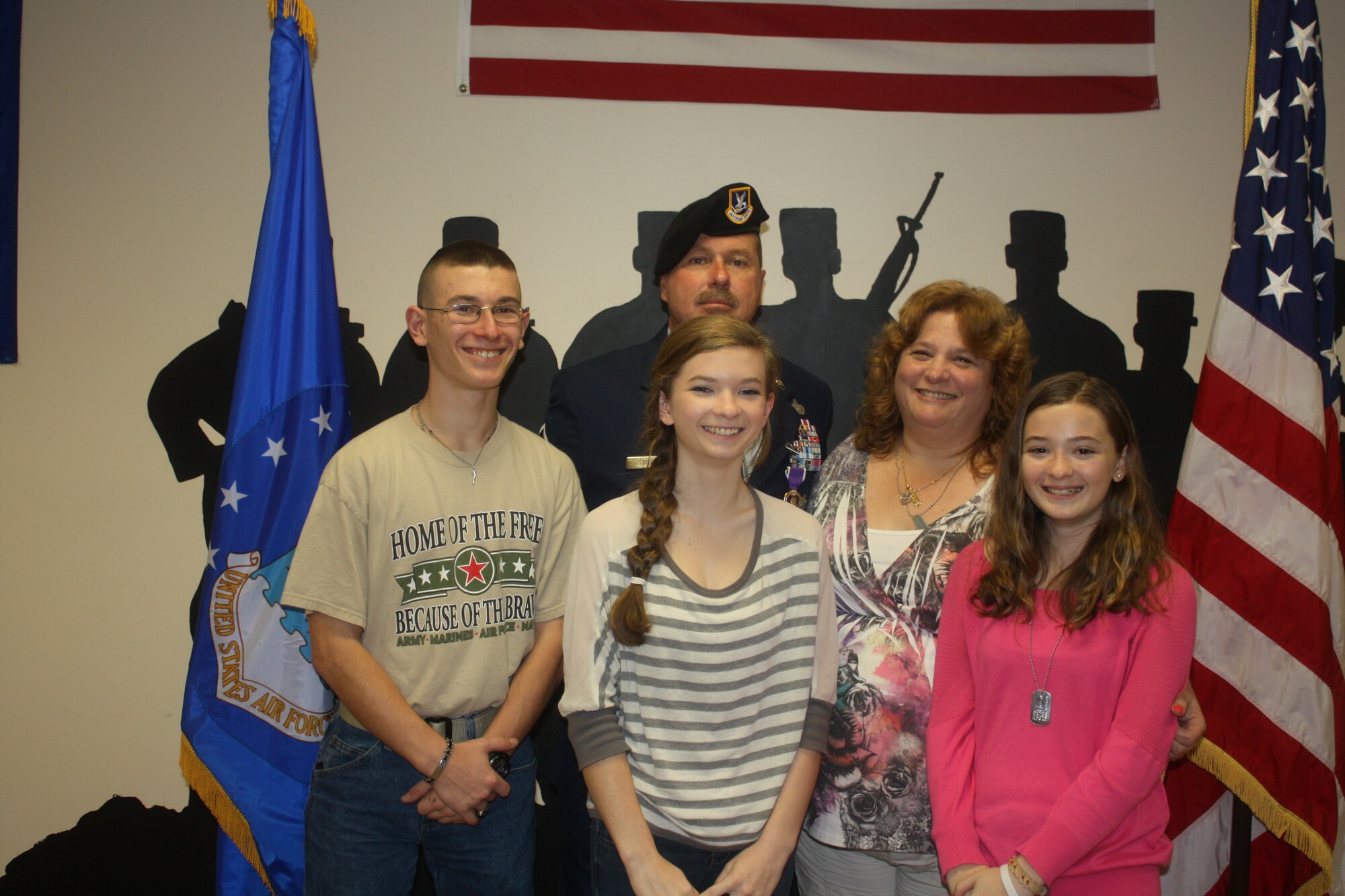 Master Sgt. Edward Sileo, a member of the 482nd Security Forces Squadron at
Homestead Air Reserve Base, Fla., his wife, Lynne Sileo, and children
Vincent Sileo, Bianca Sileo, and Marie Sileo pose for a family photo after
Edward Sileo was awarded the Purple Heart in a ceremony on Feb. 8 for
injuries sustained Jan. 21, 2010 during a deployment in Kirkuk, Iraq. Sileo
is set to medically retire July 29 due to resulting traumatic brain injury
resulting from the incident. (U.S. Air Force photo/Senior Airman Jaimi Upthegrove)  
