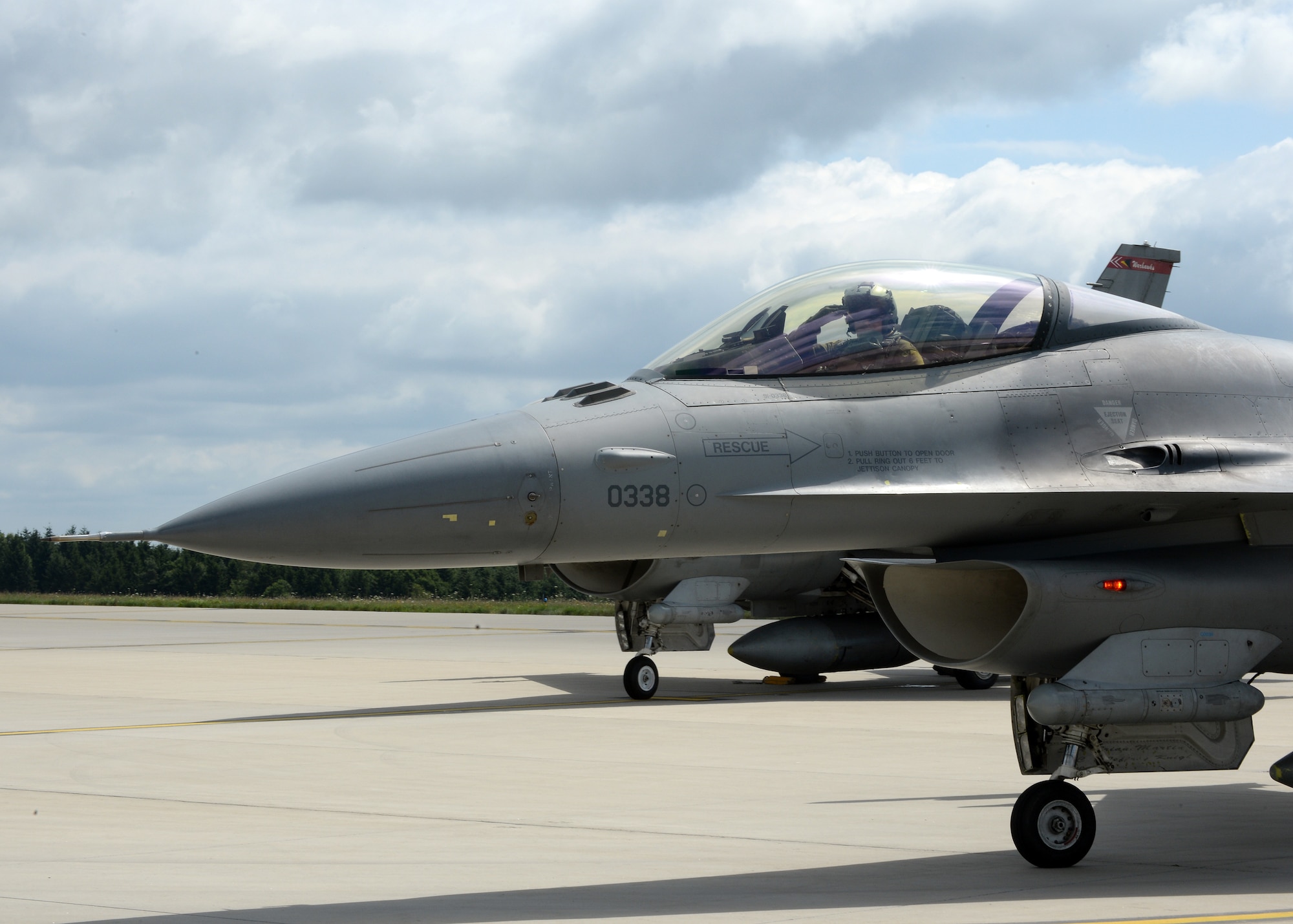 U.S. Air Force Col. Pete Bilodeau, 52nd Fighter Wing commander, salutes after his first flight in the Eifel as the wing commander July 14, 2014, at Spangdahlem Air Base, Germany. Bilodeau has been immersing himself into the Spangdahlem community and learning first-hand about the many missions of the 52nd FW. (U.S. Air Force photo by Staff Sgt. Daryl Knee/Released)