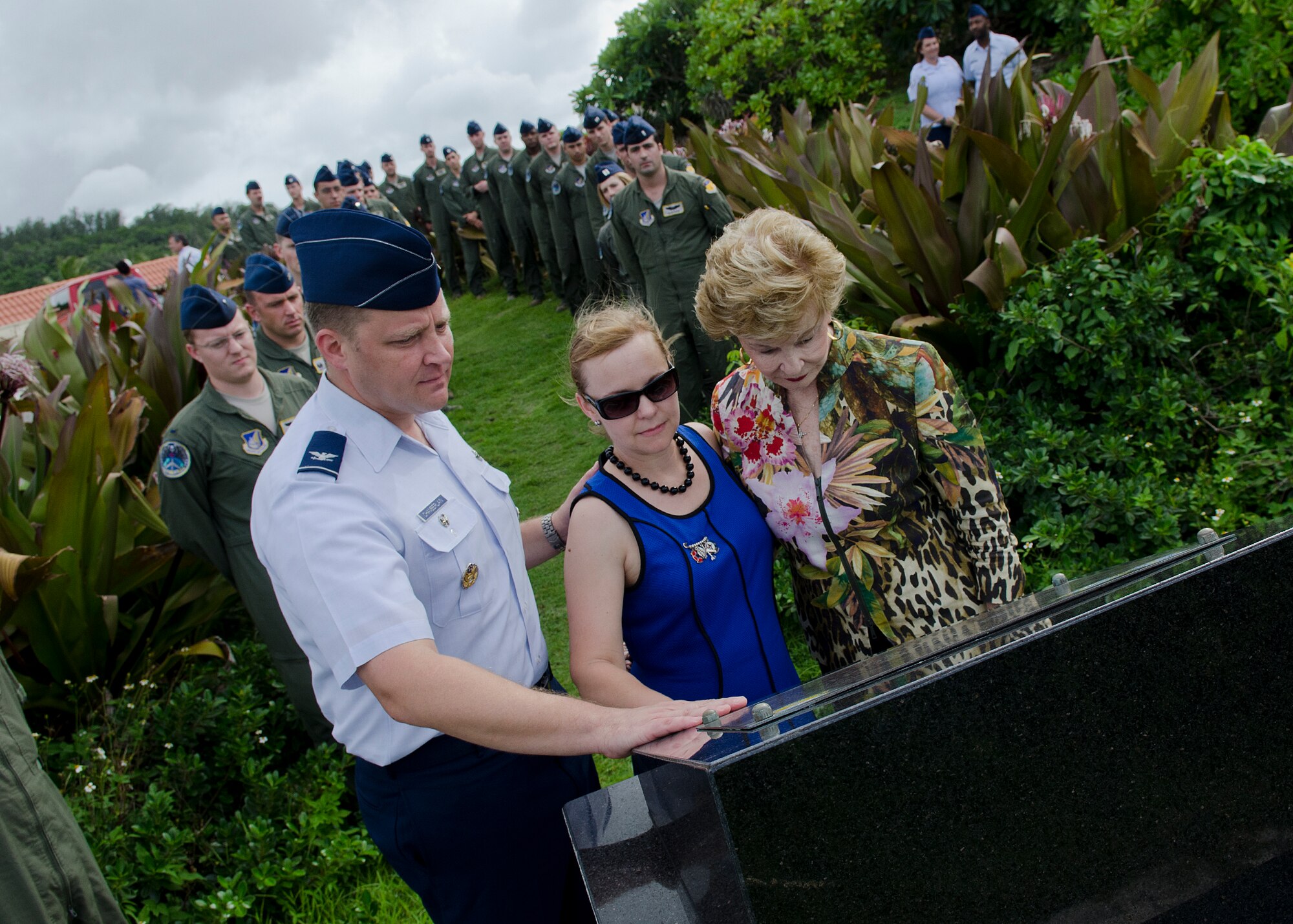 Col. Tyrell Chamberlain, 36th Wing vice commander, and his wife Elizabeth stand with Madeleine Bordallo, Guam’s U.S. Congress representative, at the Raider 21 memorial July 21, 2014, in Adelup, Guam. Members of Team Andersen and Government of Guam representatives gather annually to honor the aircrew lost during a mission in support of the 2008 Liberation Day parade. (U.S. Air Force photo by Senior Airman Katrina M. Brisbin/Released)