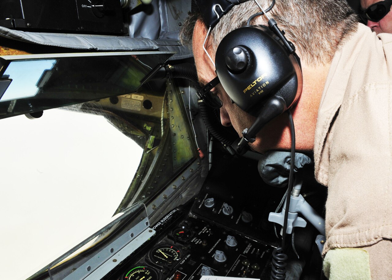 Air Force Senior Master Sgt. Floyd W. Atkins refuels a B-1B Lancer over Afghanistan, July 17, 2014. U.S. Air Force photo by Senior Airman Colin Cates