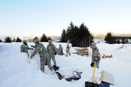 Alaska National Guard members clear a building roof in Cordova on Jan. 9, 2012. There are currently 57 National Guard members assisting citizens in this small Alaska town dig out from a series of winter storms.