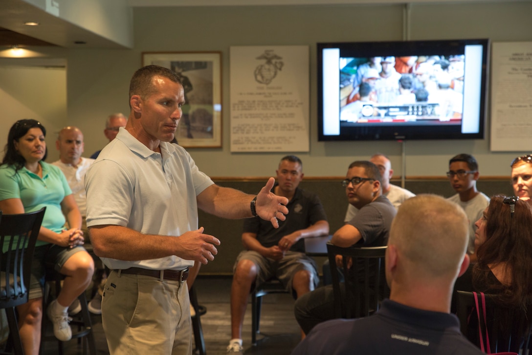 U.S. Marine Corps Lt. Col. Randal Walsh, left, speaks to the parents and teens participating in the 12th Marine Corps District's first annual Teen Summit aboard Marine Corps Recruit Depot San Diego, June 21, 2014.