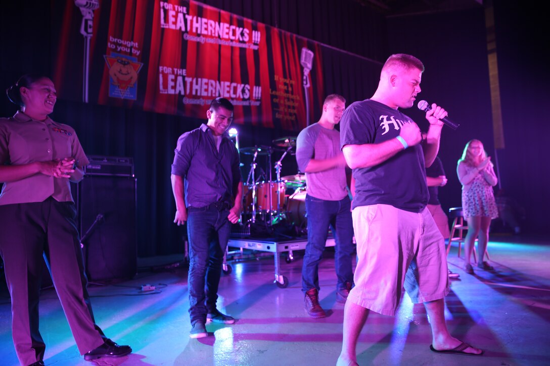 Marines and Sailors participate in a sing and dance-a-long to the Backstreet Boys "I want it that way" during a portion of the For the Leathernecks III Comedy and Entertainment Tour at the Twin Rivers Theater at Marine Corps Air Station Cherry Point, July 25, 2014. The tour served as an opportunity for active duty service members to enjoy food, laughter and music.


