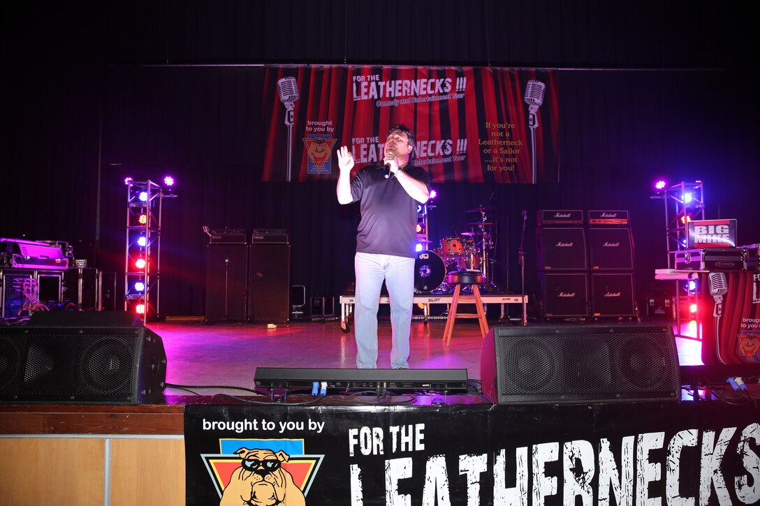 Comedian Sam Fedele tells a joke to an audience of Marines and Sailors during the For the Leathernecks III Comedy and Entertainment Tour at the Twin Rivers Theater at Marine Corps Air Station Cherry Point, July 25, 2014. Fedele is a former Marine who delivers a unique comedy act that leaves his crowd full of energy and laughter.


