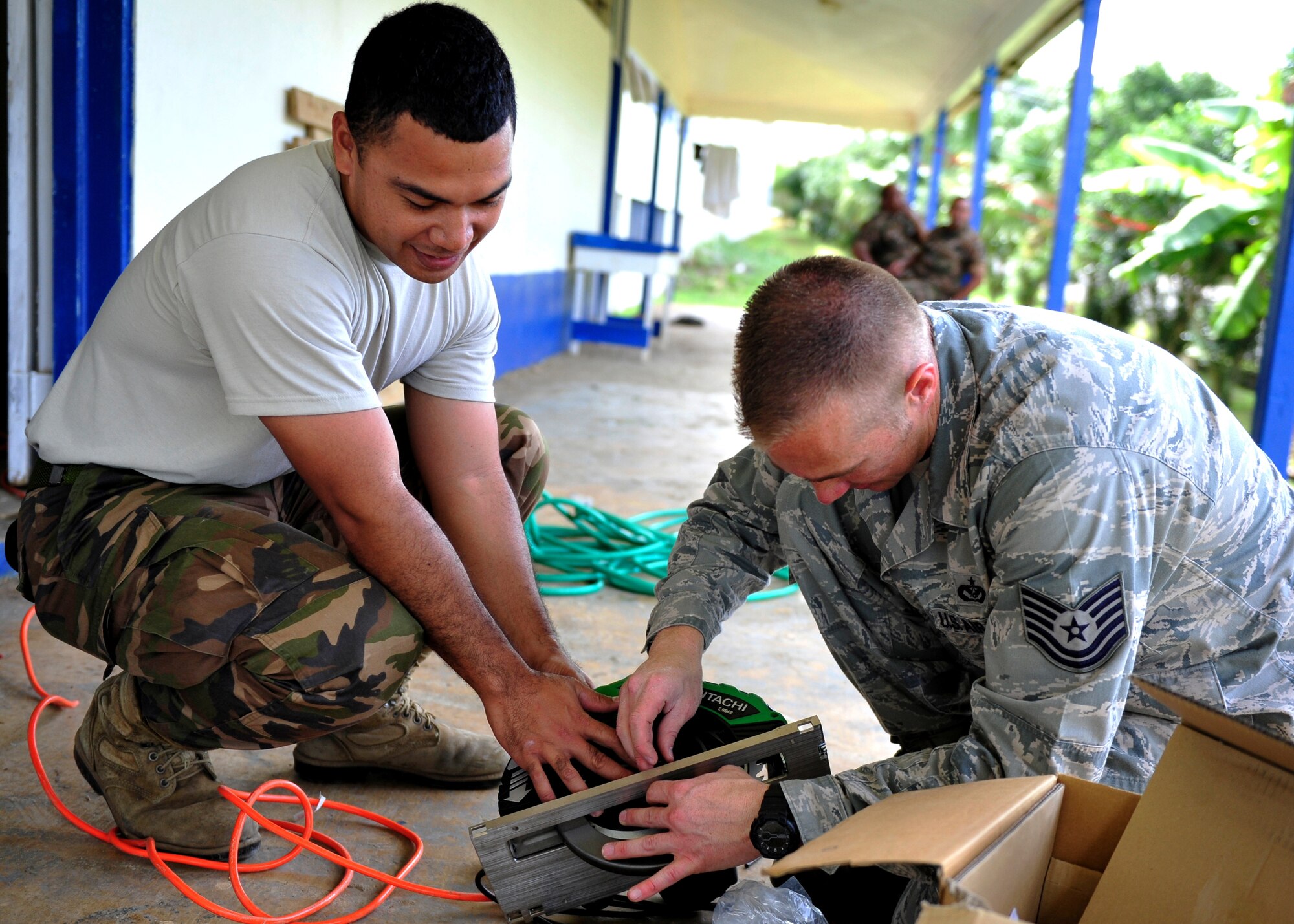 U.S. Airmen and personnel from Tonga’s armed forces work together during an engineering civic action project at Mailefihi Siu’ilikutapu College, a future health services outreach site, in preparation for Pacific Angel July 14, 2014 in Vava’u, Tonga. PACANGEL is an annual regional humanitarian assistance and disaster relief operation lead by Pacific Air Forces. (U.S. Air Force photo/Capt. Cody Chiles)