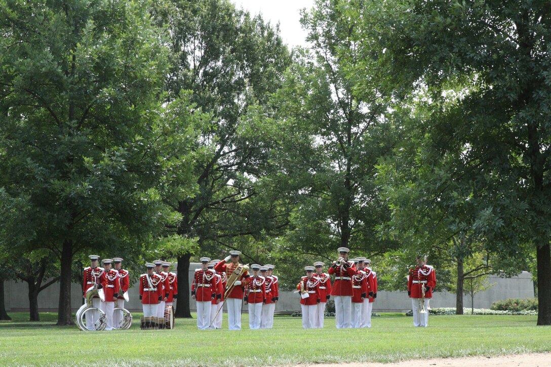 On July 29, 2014, the Marine Band, led by Assistant Drum Major Staff Sgt. Steven Williams, participated in the funeral for World War II casualty Pfc. Randolph Allen, USMC. Pfc. Allen was killed in action on Nov. 20, 1943 during the Battle of Tarawa in the central Pacific Ocean. From Nov. 12-27, 2013, History Flight, a private organization, excavated what was believed to be a wartime fighting posit...ion on the island of Betio. During this excavation History Flight recovered five sets of remains. The Joint POW/MIA Accounting Command used circumstantial evidence and forensic identification tools to identify Pfc. Allen. His remains were returned to the United States and buried at Arlington National Cemetery with full military honors. Gunnery Sgt. Robert Singer rendered Taps. (U.S. Marine Corps photo by Master Sgt. Kristin duBois/released)