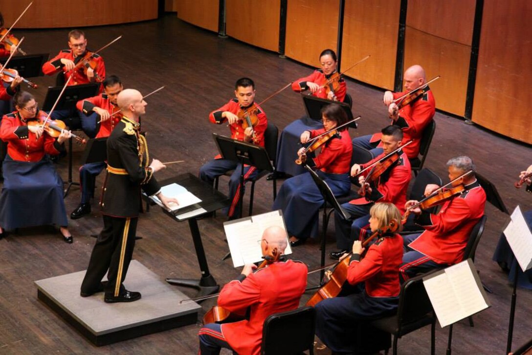 Marine Band Director Lt. Col. Jason K. Fettig conducted the Marine Chamber Orchestra on July 19, 2014 at the Rachel M. Schlesinger Concert Hall at Northern Virginia Community College in Alexandria. The program included Wolfgang Amadeus Mozart’s Adagio and Fugue in C minor, K. 546; Dmitri Shostakovich’s Chamber Symphony, Opus 110a; Jean Sibelius’s Impromptu for String Orchestra; and Mieczyslaw Karlowicz’s Serenade for String Orchestra, Opus 2. (U.S. Marine Corps photo by Master Sgt. Kristin duBois/released)