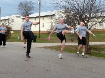 Missouri Army National Guard 1st Lt. Adam Von Allmen, center, conducts a high-kick drill as part of the 140th Regiment Missouri Regional Training Institute's Unit Fitness Coordinator Course at Fort Leonard Wood on Dec. 14, 2011.