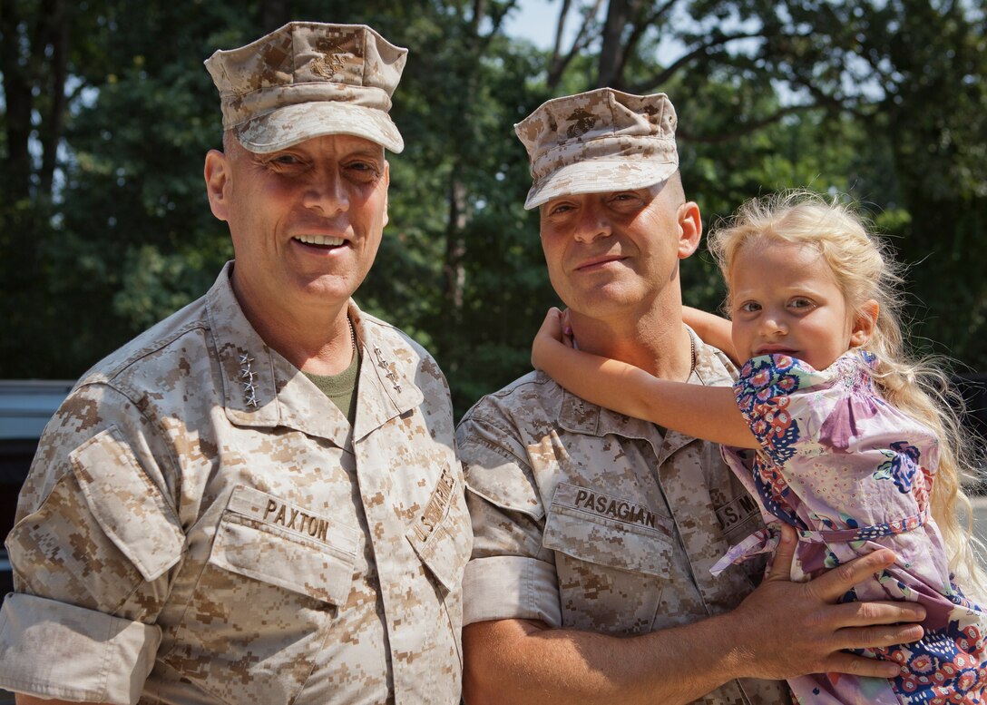 The Assistant Commandant of the Marine Corps, Gen. John M. Paxton, Jr., left, poses for a photo with Col. Arthur J. Pasagian before the change of command ceremony for the Marine Corps Operational Test and Evaluation Activity (MCOTEA), on Marine Corps Base Quantico, Va., July 29, 2014. Col. Arthur J. Pasagian relinquished command of MCOTEA to Col. Keith M. Moore. (U.S. Marine Corps photo by Cpl. Tia Dufour/Released)
