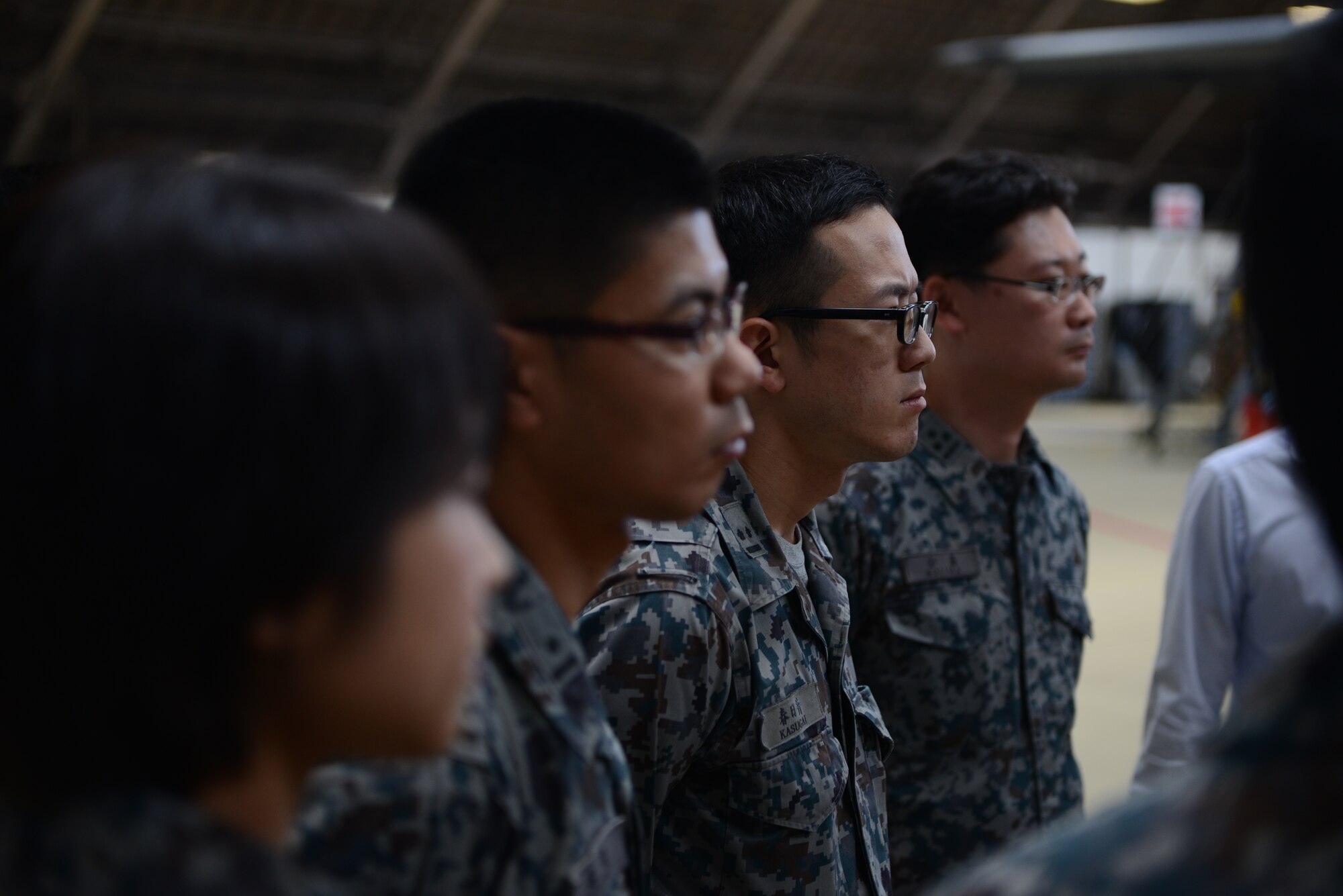 YOKOTA AIR BASE, Japan -- Japan Air Self-Defense Force students from the Basic Maintenance Officer Course listen to a description of isochronal inspections done on C-130 Hercules at Yokota Air Base Japan, July 29, 2014. The JASDF visited Yokota from Hamamatsu Air Base to give them an idea of the similarities and differences between U.S. and Japanese military operations and aircraft maintenance. (U.S. Air Force photo by Staff Sgt. Cody H. Ramirez/Released)