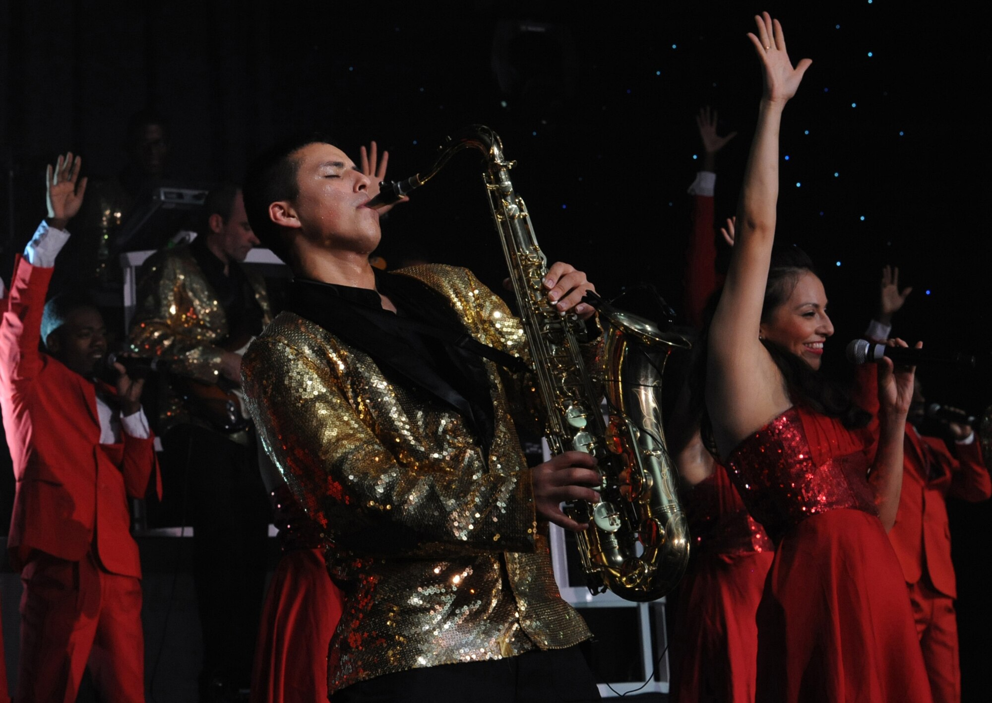U.S. Air Force Senior Airman Gabriel Villaneuva, Tops in Blue saxophonist, nails a solo center stage at the Keystone Theater on Kadena Air Base, Okinawa, Japan on July 27, 2014. Tops in Blue is an all-active duty Air Force special unit made up of talented amateur performers selected for their entertainment abilities. (U.S. Air Force photo by Airman 1st Class Zackary A. Henry/Released)