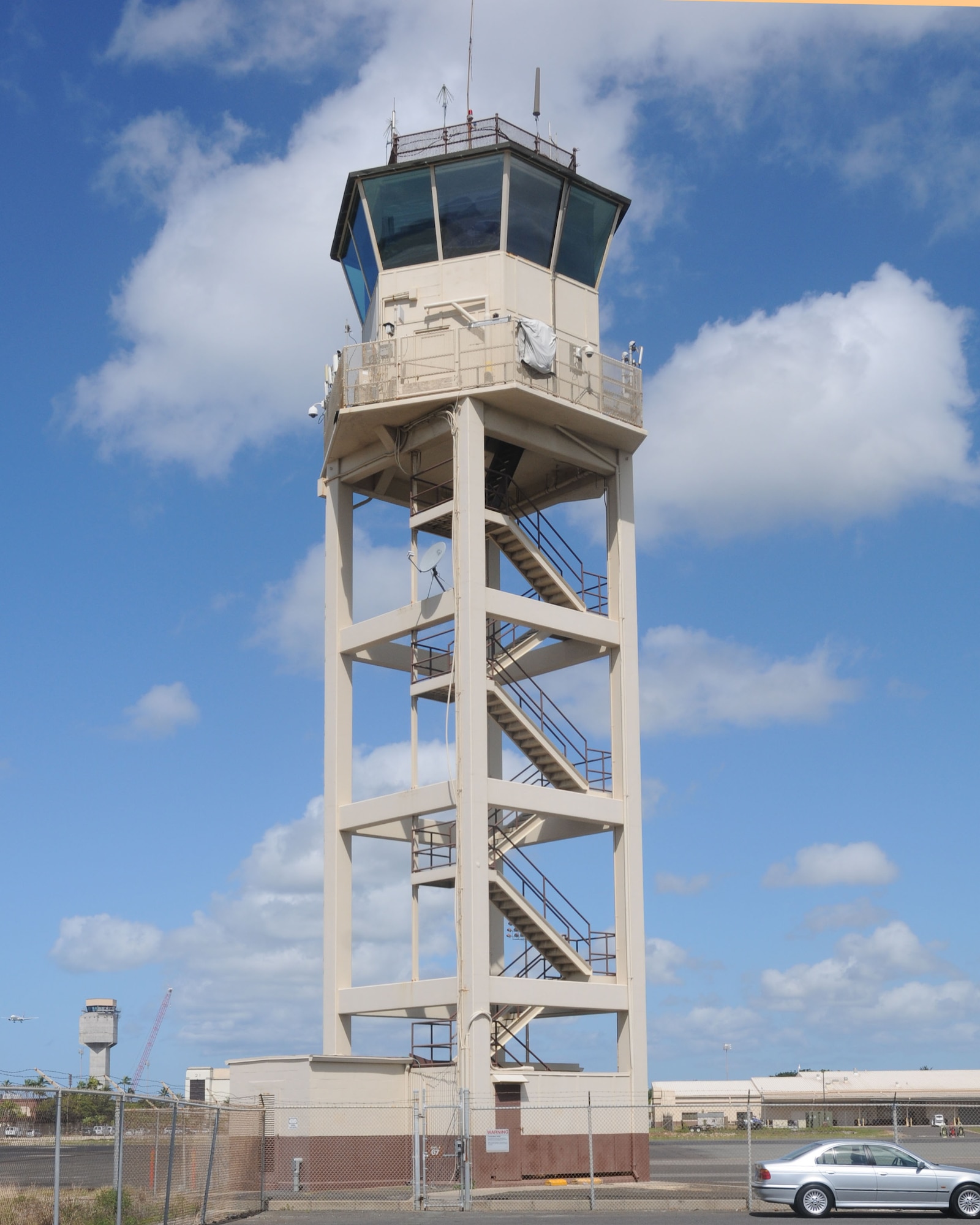 The Hickam Ramp Facility houses aerodrome surveillance specialists during Rim of the Pacific 2014 at Joint Base Pearl Harbor-Hickam, Hawaii, July 28, 2014. Specialists atop the facility assist incoming and outgoing military aircraft before and after they have communication with the Honolulu Control Tower. More than 200 aircraft and 25,000 personnel are participating in RIMPAC from June 26- Aug. 1 in and round Hawaii and California. RIMPAC provides a unique training opportunity that helps participants foster and sustain the cooperative relationships that are critical to ensuring the safety of sea lanes and the security of the world’s oceans. (U.S. Air Force photo by Tech. Sgt. Mandy Johnson/Released) 
