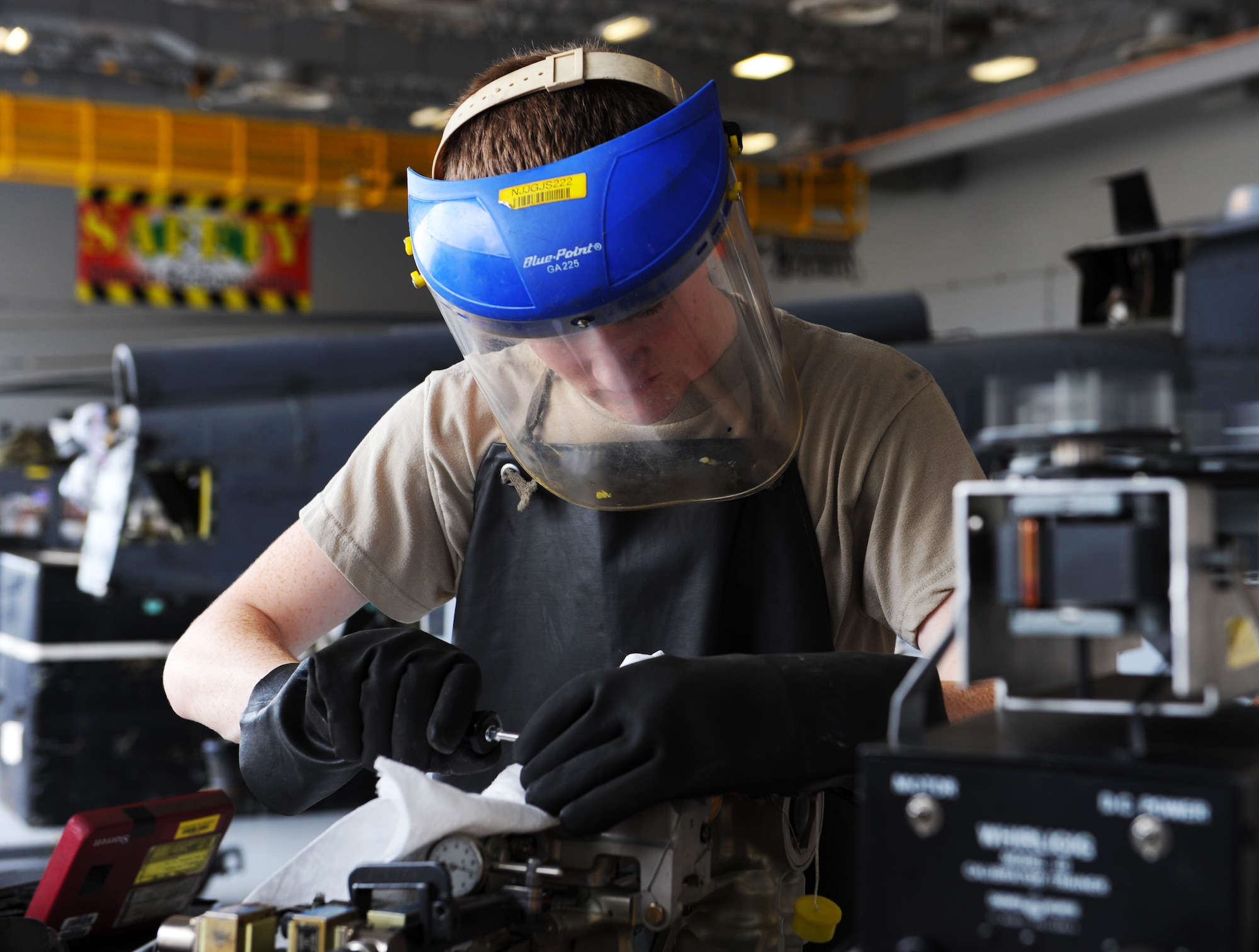 Airman 1st Class Joseph Stuart, 823rd Maintenance Squadron guidance and control specialist, makes adjustments on a piece of equipment for an HH-60G Pave Hawk during an accelerated inspection phase, July 25, 2014, at Nellis Air Force Base, Nev. The 823rd MXS is currently working with Airmen from the 923rd Aircraft Maintenance Squadron from Davis-Monthan AFB, Ariz., in an accelerated inspection phase.  (U.S. Air Force photo by Airman 1st Class Thomas Spangler)