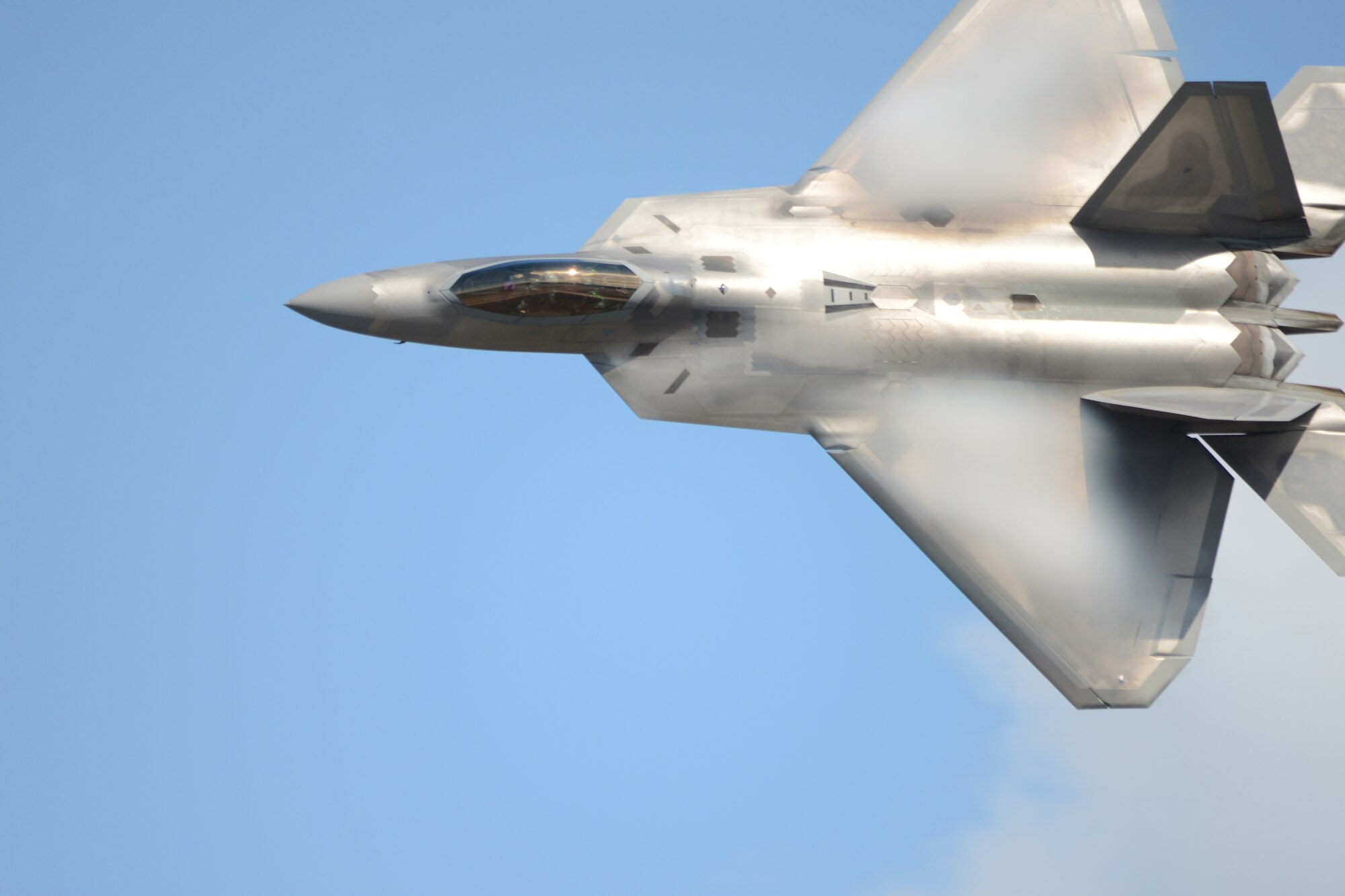 An F-22 performs during the Arctic Thunder Open House event hosted by Joint Base Elmendorf-Richardson, Alaska, July 26, 2014. Arctic Thunder is the largest two-day event in the state and one of the premier aerial demonstrations in the world. (U.S. Air Force photo by Tech. Sgt. Dana Rosso) 