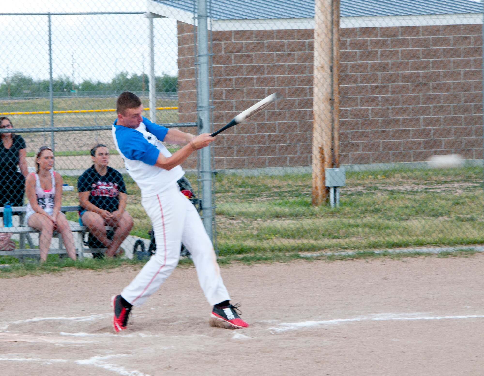 Dylan Grubaugh, 90th Missile Security Forces Squadron, makes a solid hit during the intramural softball game between the 90th MUNS and the 90th Missile Security Forces Squadron July 28, 2014, on one of the F.E. Warren Air Force Base, Wyo., softball fields. MUNS clinched the win over “Big Missiles” 18 to 13. (U.S. Air Force photo by Airman 1st Class Jason Wiese)
