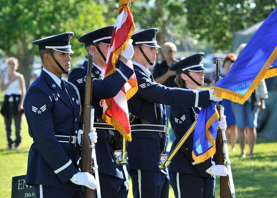 Members of the Malmstrom Air Force Base Honor Guard present the colors July 24 at The Wall That Heals opening ceremony and memorial service at Elk’s Riverside Park in Great Falls, Mont. From left to right are Senior Airmen Phillip Gomes, Charles Sena, Justin Colberg, and Kathleen Hastings. (U.S. Air Force photo/John Turner)