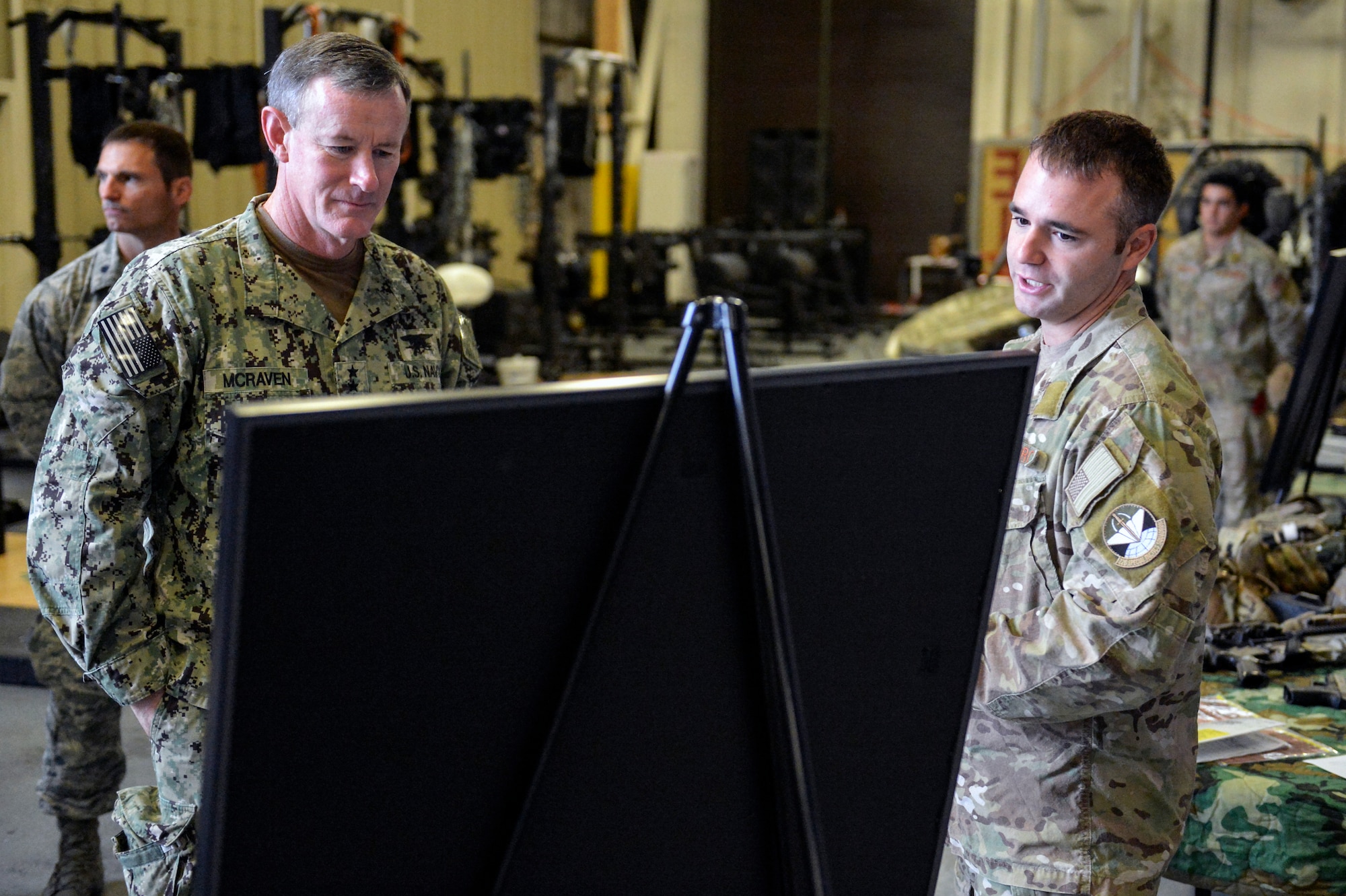 Tech. Sgt. Matthew McKenna (right), 22nd Special Tactics Squadron combat controller, describes a 48-hour 22nd STS joint operation with Operational Detachment Alpha to Adm. William McRaven, U.S. Special Operations Command commander, July 23, 2014, at Joint Base Lewis-McChord, Wash. During his visit, McRaven spoke to the 22nd STS Airmen about how special operations forces are in a growth industry and their skills will remain in high demand. (U.S. Air Force photo/Staff Sgt. Russ Jackson)